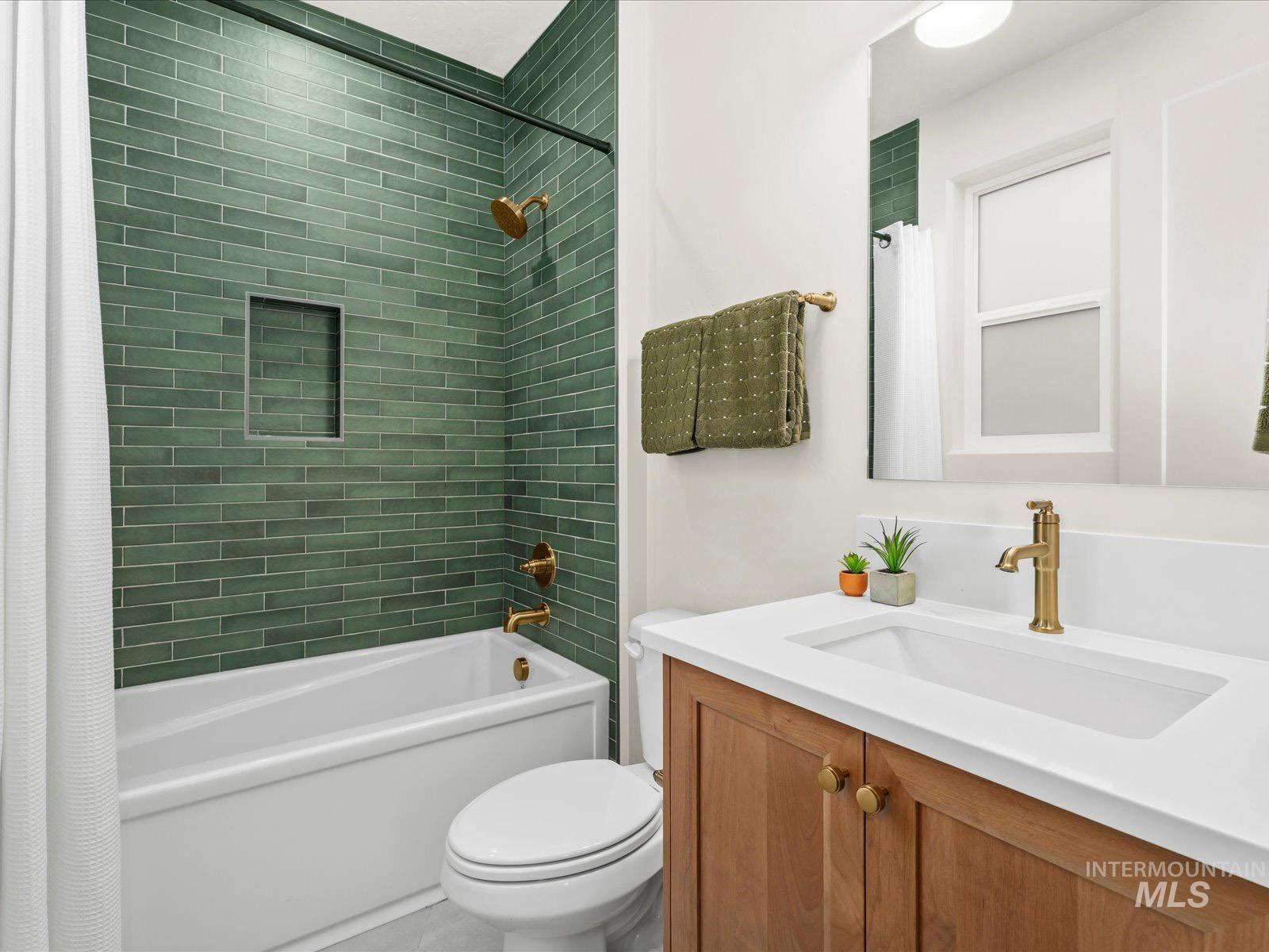 Full bathroom with shower / tub combo and vanity