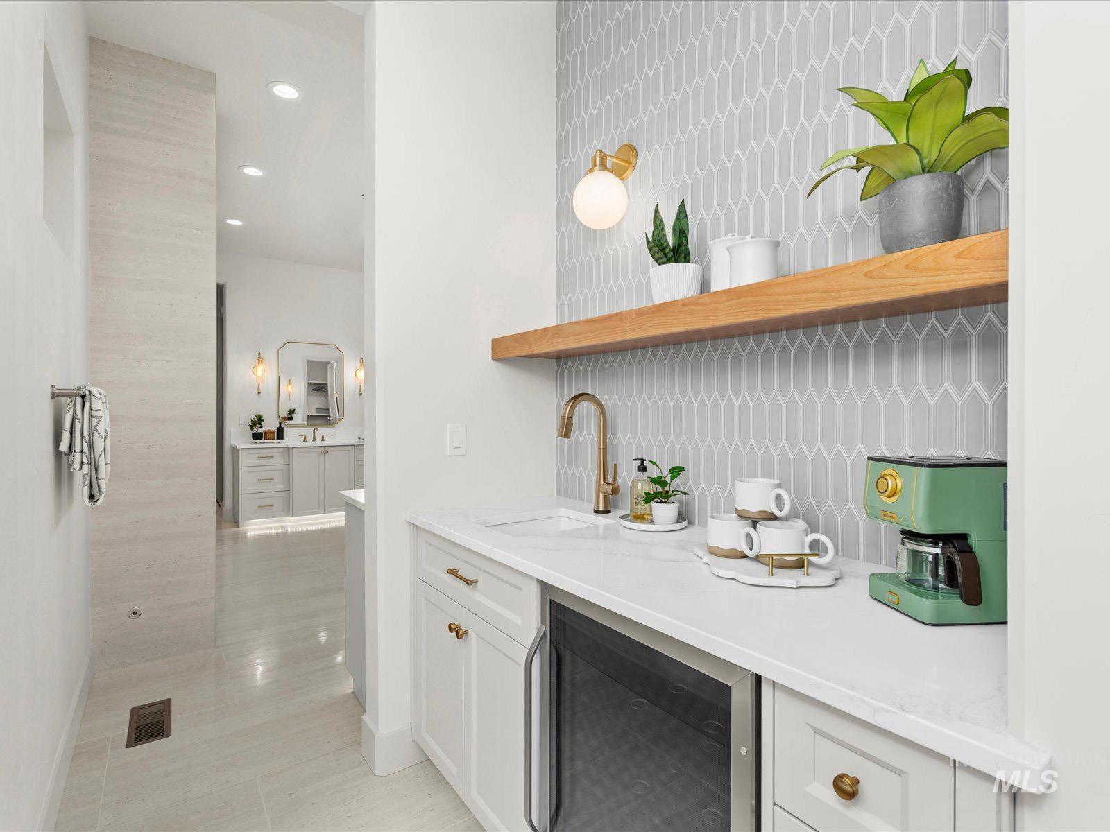 Bar featuring open shelves, wine cooler, light stone counters, recessed lighting, and decorative backsplash