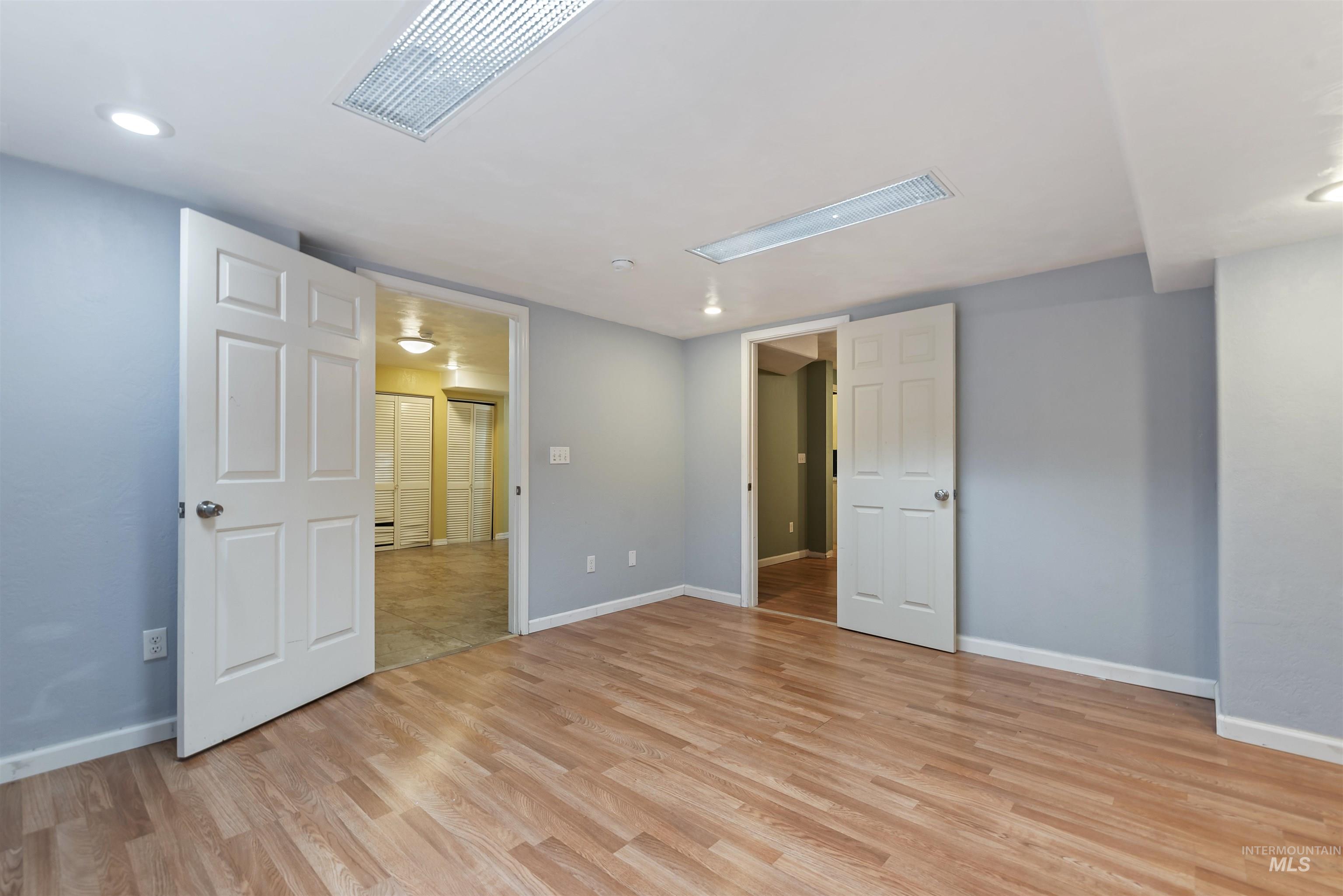 Unfurnished bedroom with recessed lighting and light wood-style flooring