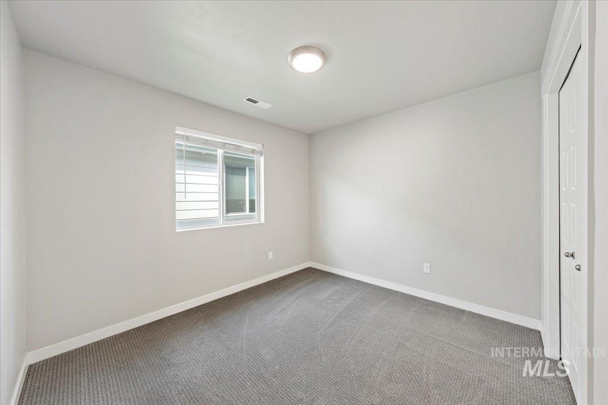 Unfurnished bedroom with carpet and a closet