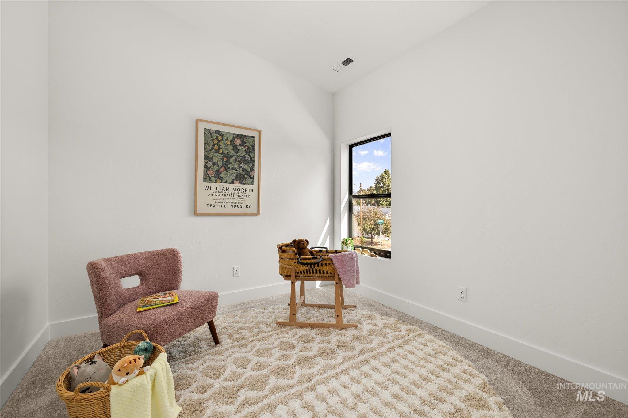 Sitting room with carpet flooring