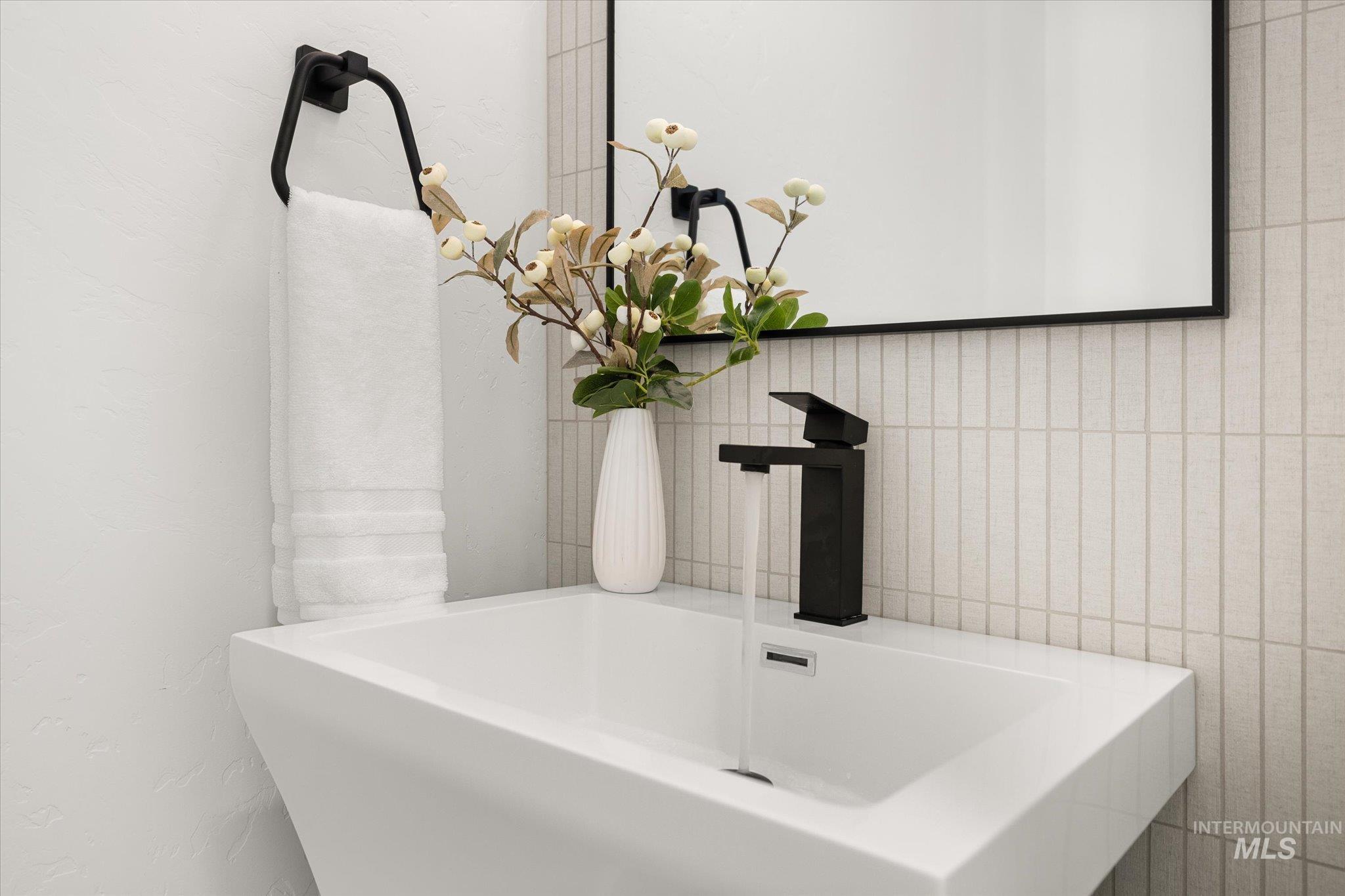 Full bath with a freestanding tub and tile walls