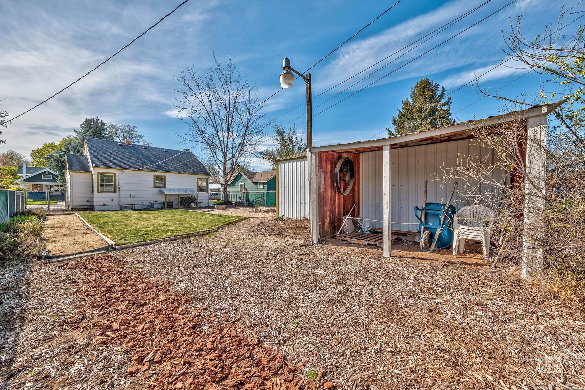 View of yard with an outdoor structure