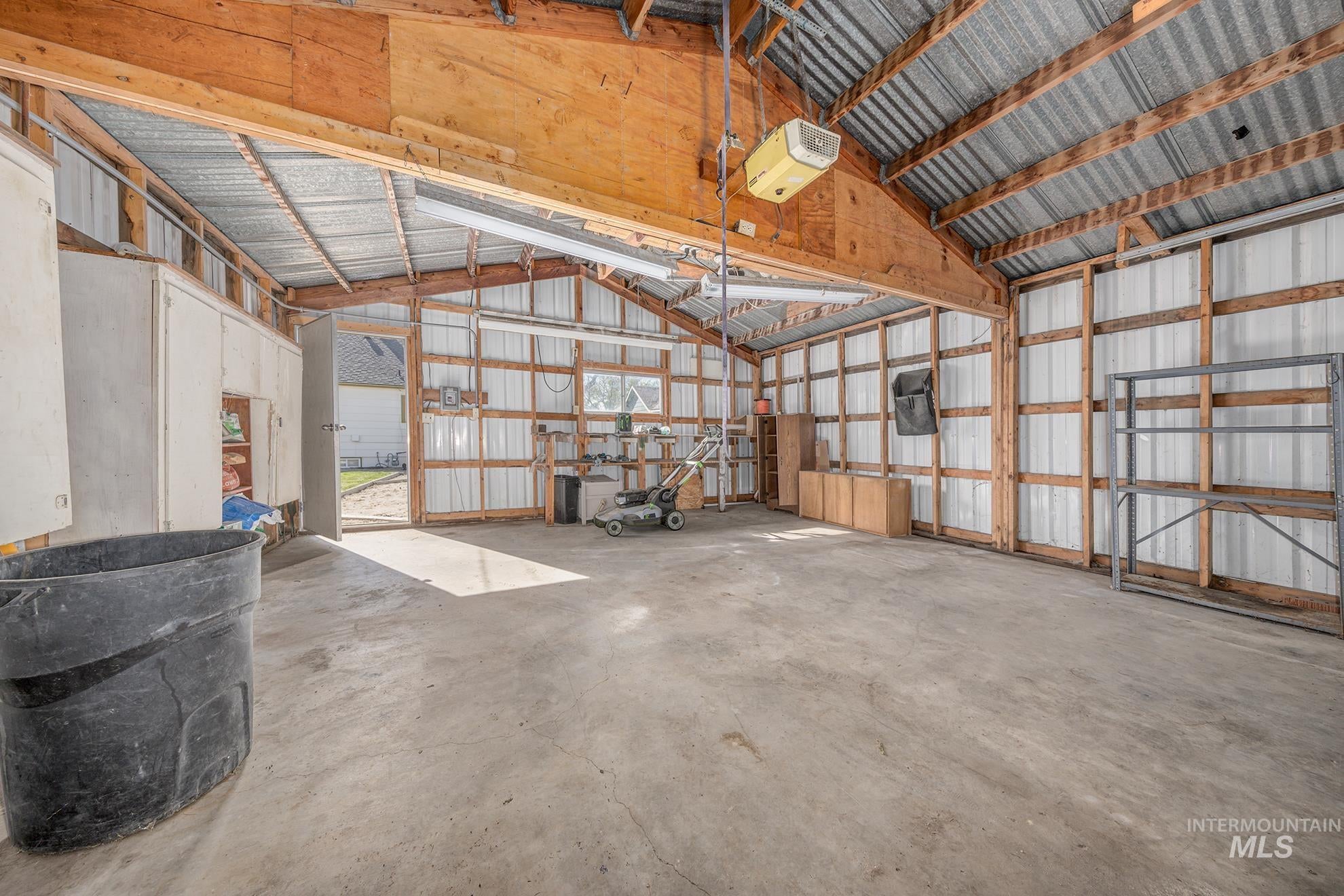 Garage with metal wall and a garage door opener