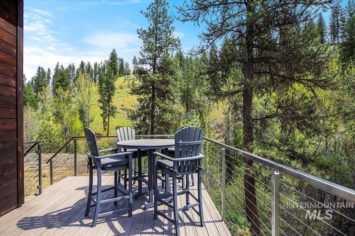 Wooden deck featuring outdoor dining space