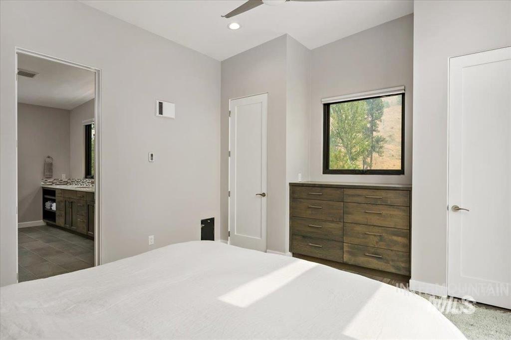 Bedroom with ceiling fan, recessed lighting, and ensuite bathroom