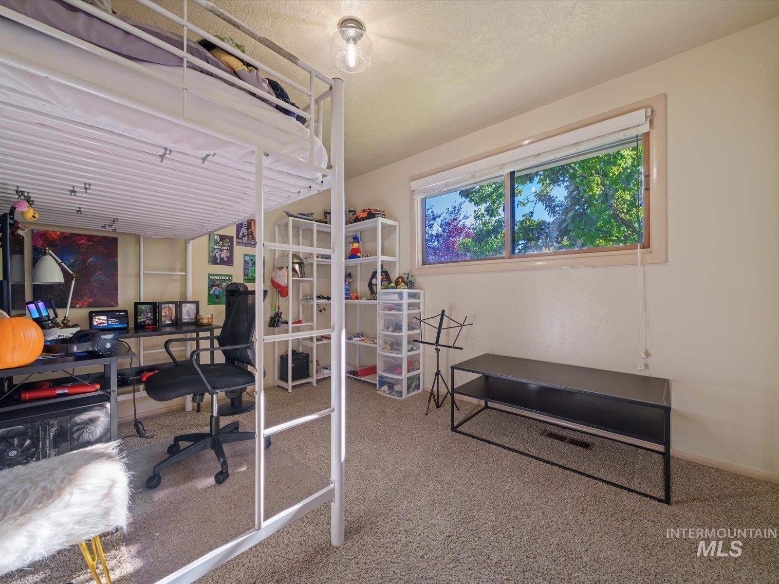 Bedroom with light carpet