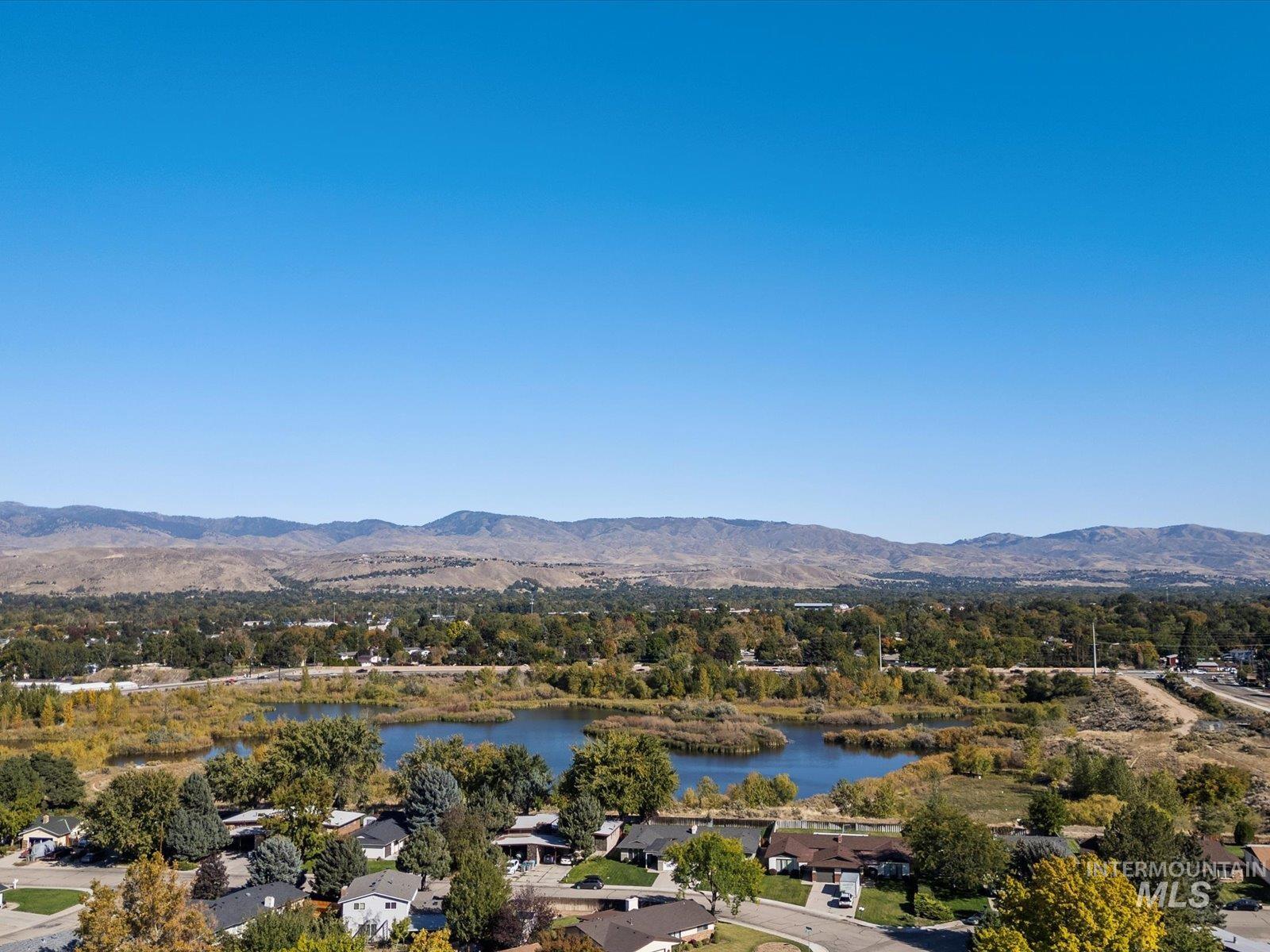 Aerial view of residential area with a water and mountain view