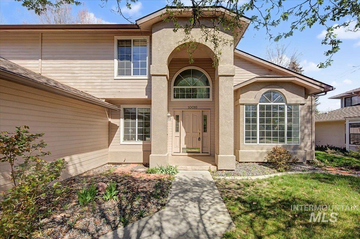 View of exterior entry featuring stucco siding