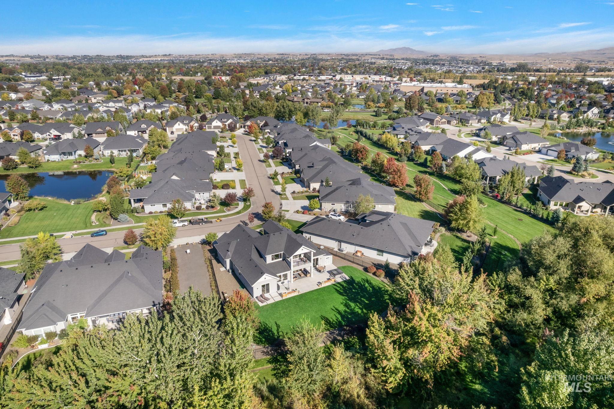 View of property location with a water and mountain view and nearby suburban area