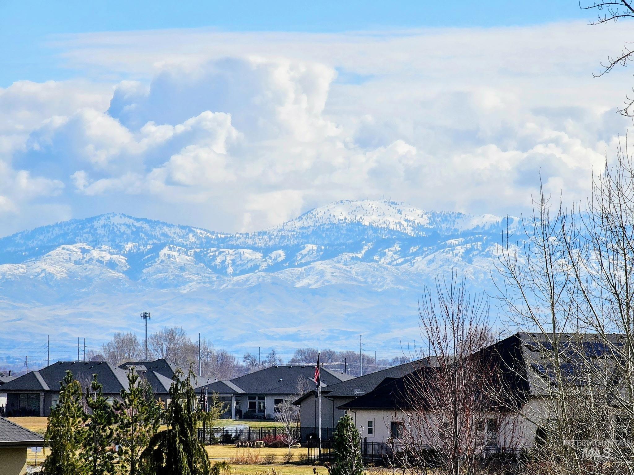 View of mountain backdrop with nearby suburban area
