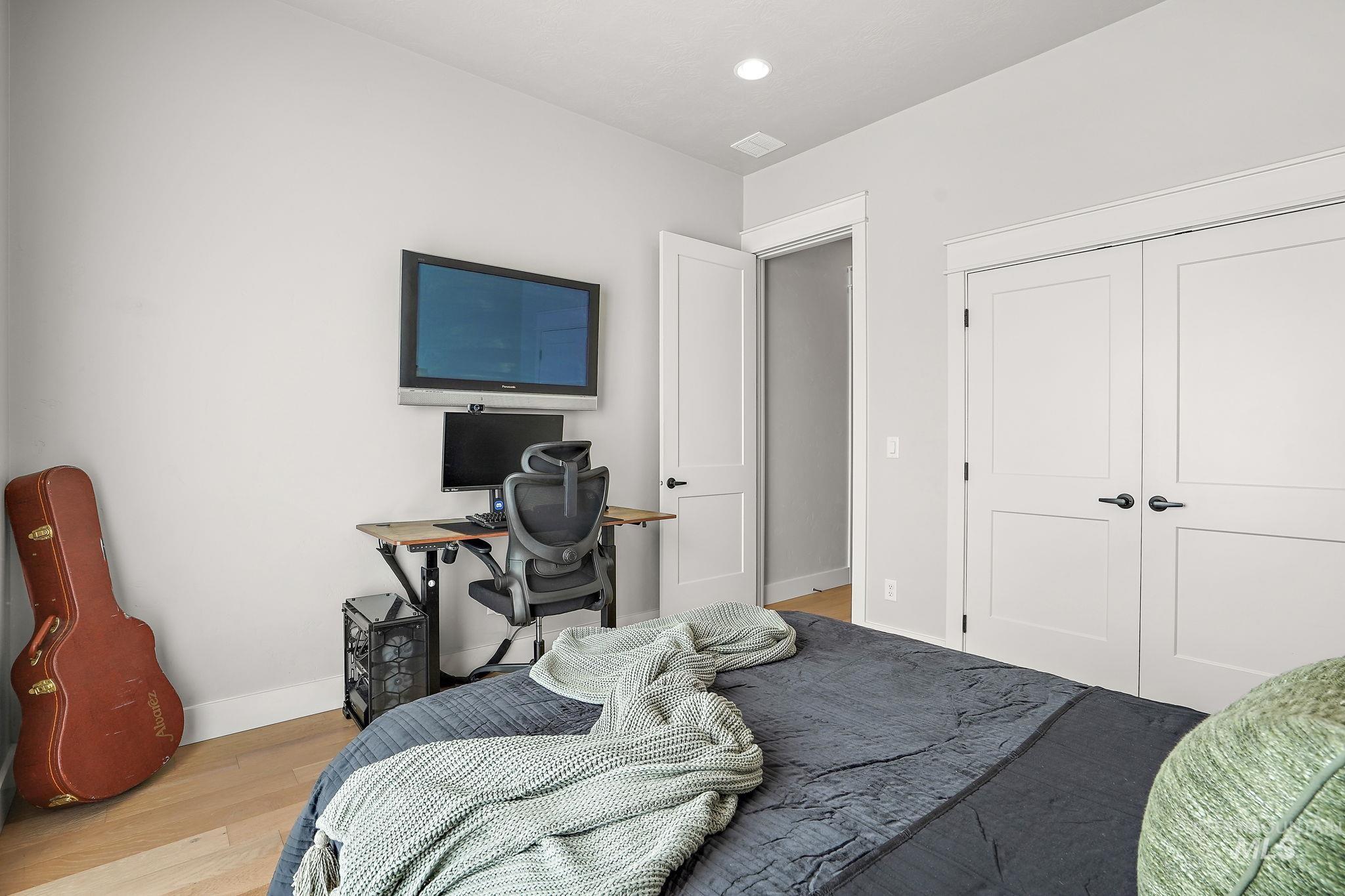 Bedroom with wood finished floors
