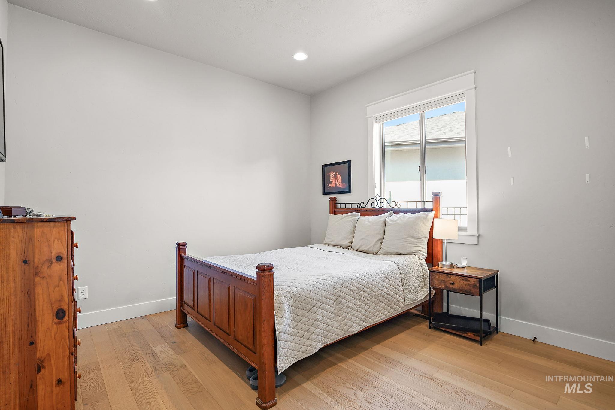 Main level spare bedroom with hardwood floors