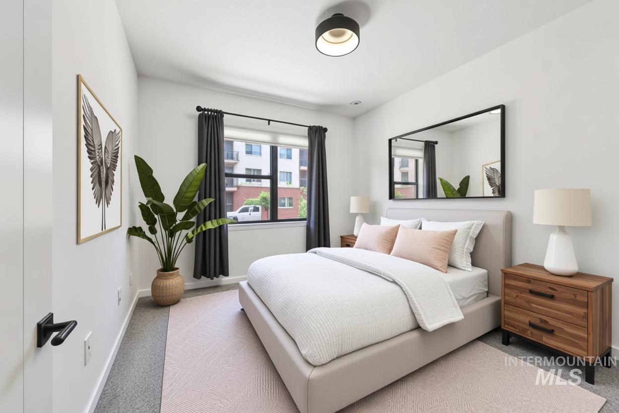 Carpeted bedroom with baseboards