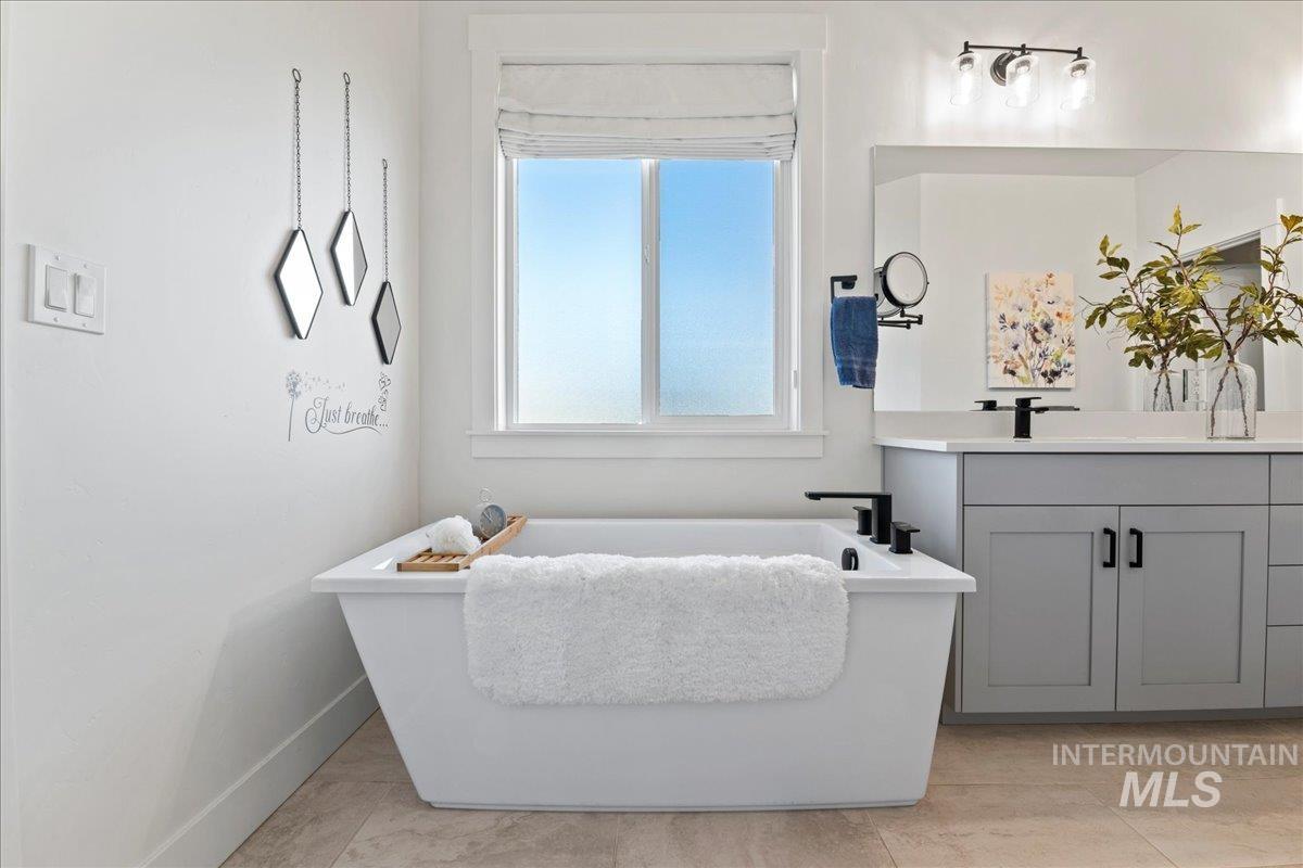 Bathroom featuring vanity and a freestanding tub