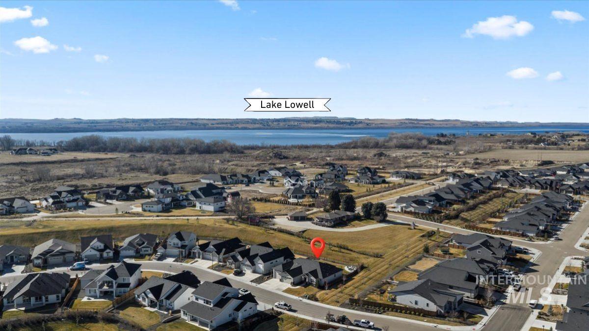 Aerial perspective of suburban area with a large body of water
