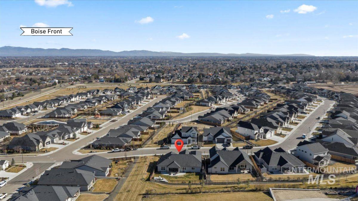 Aerial overview of property's location with nearby suburban area