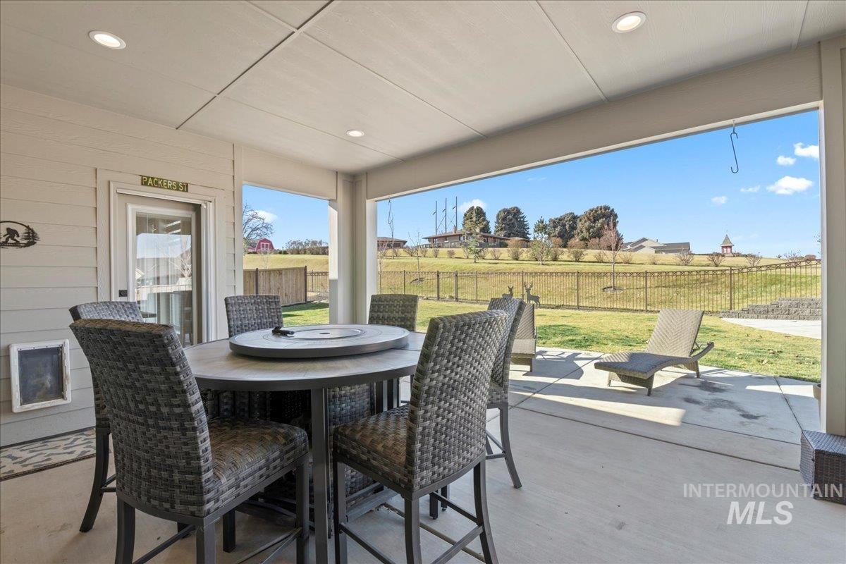 Sunroom / solarium featuring recessed lighting, wood finished floors, and wood walls