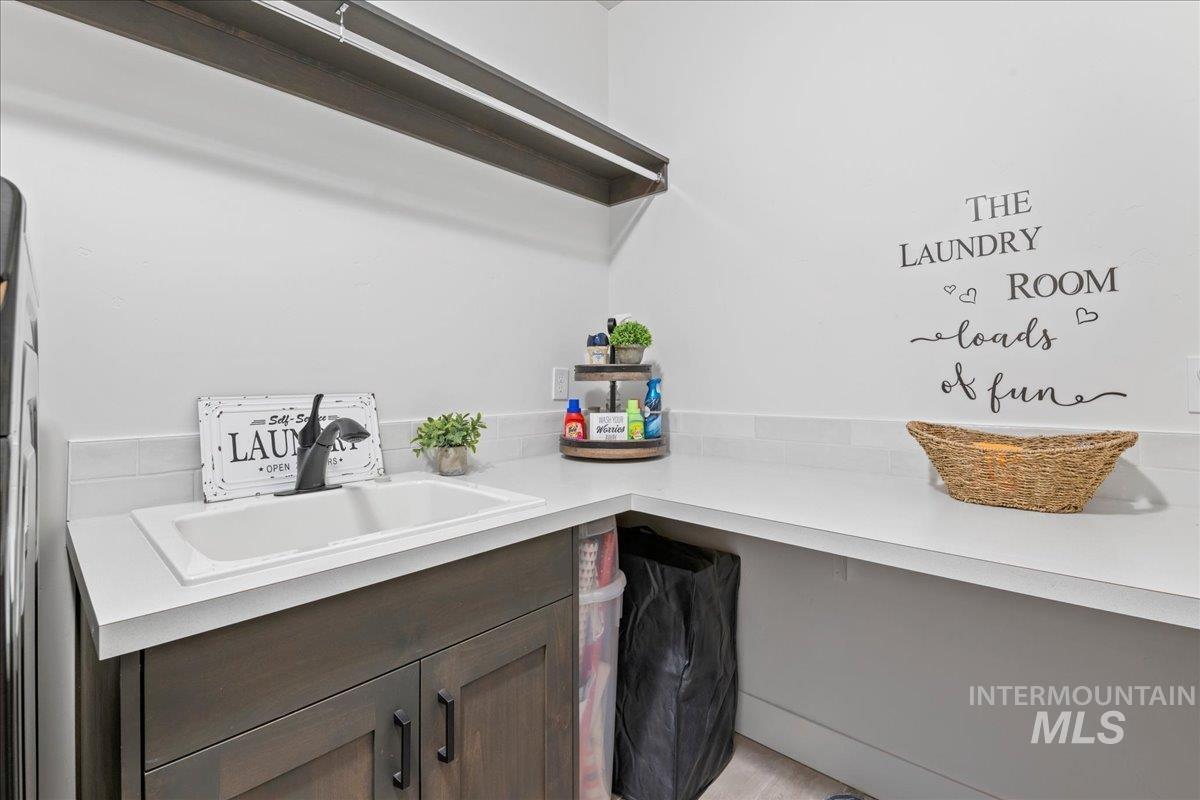 Laundry room featuring a sink