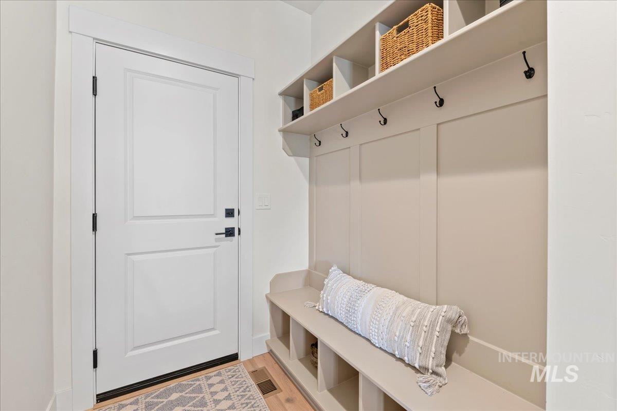 Mudroom with light wood-style flooring
