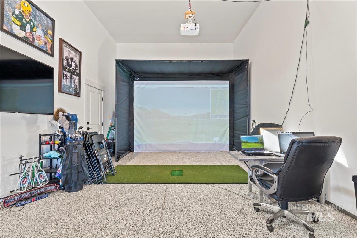 RV garage featuring golf simulator