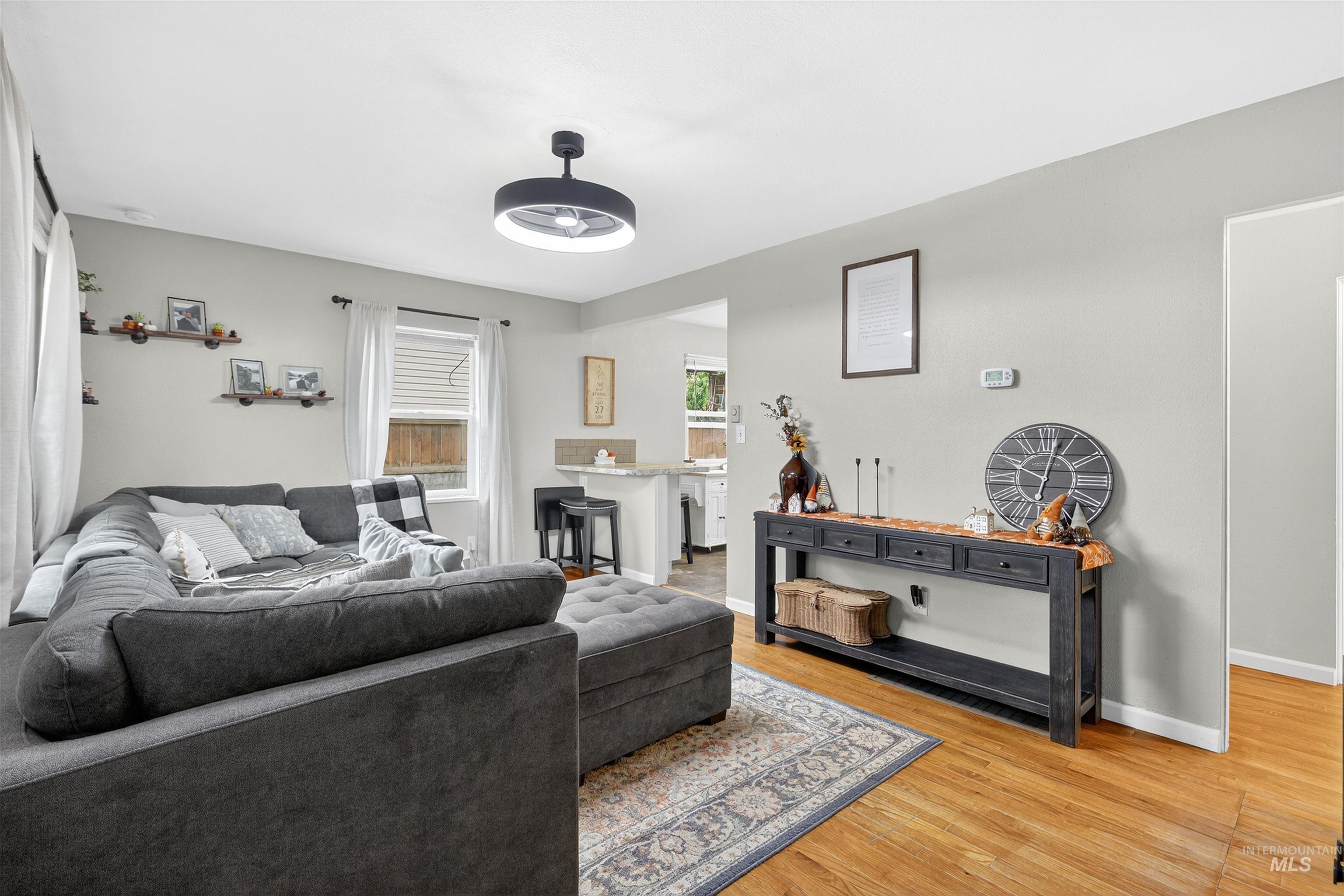 Living room with light wood finished floors and baseboards