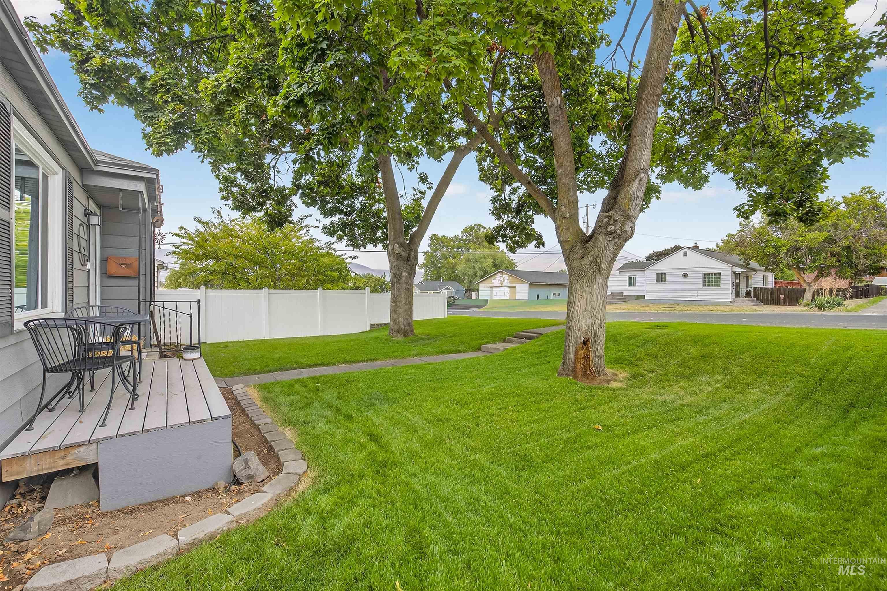 View of yard with a residential view and a wooden deck