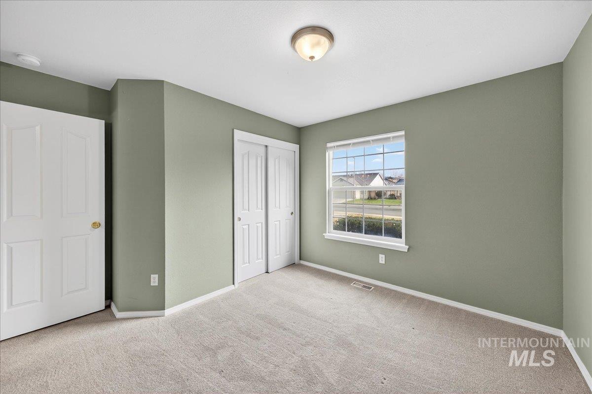 Unfurnished bedroom with carpet floors and a closet