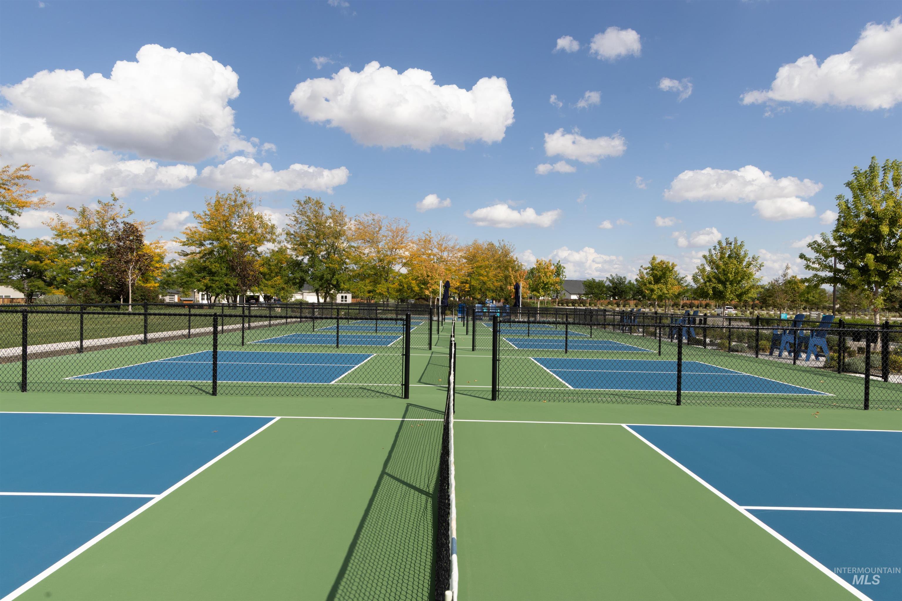 View of tennis court featuring community basketball court