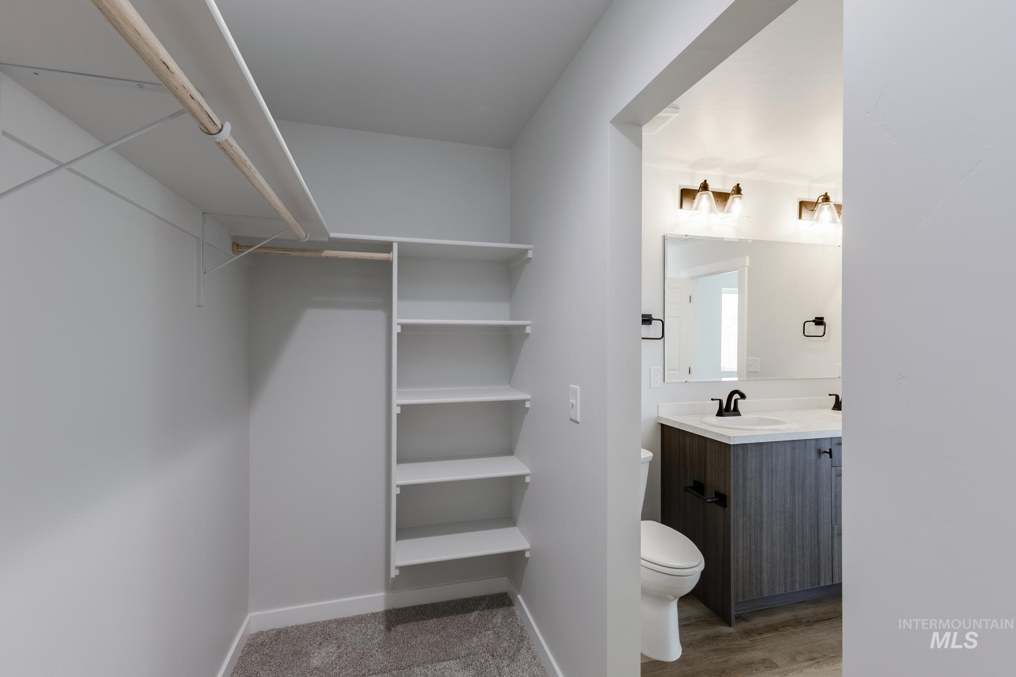 Half bath featuring vanity and toilet