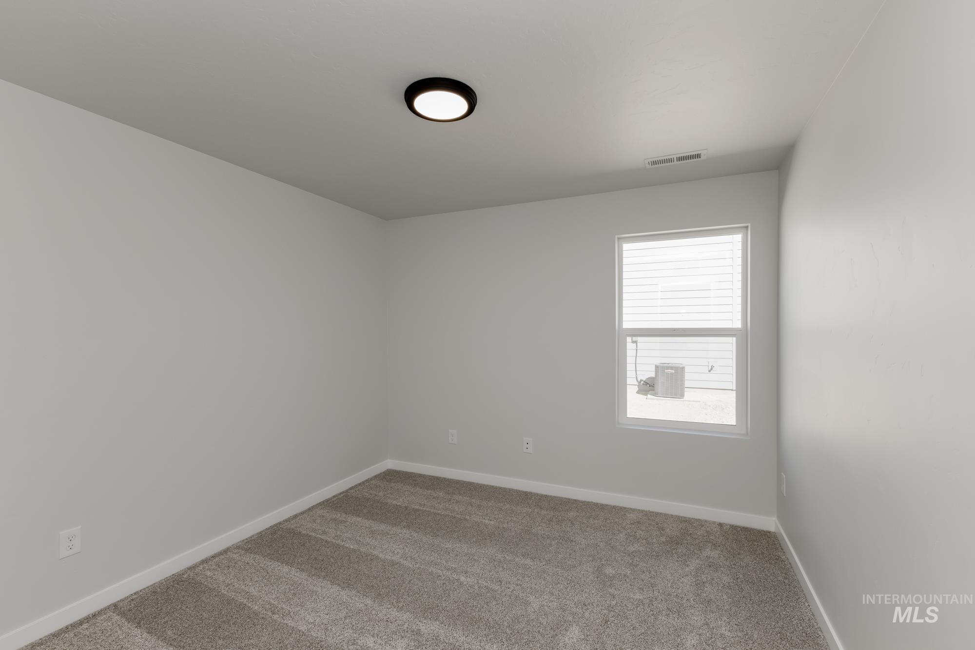 Spare room with carpet flooring