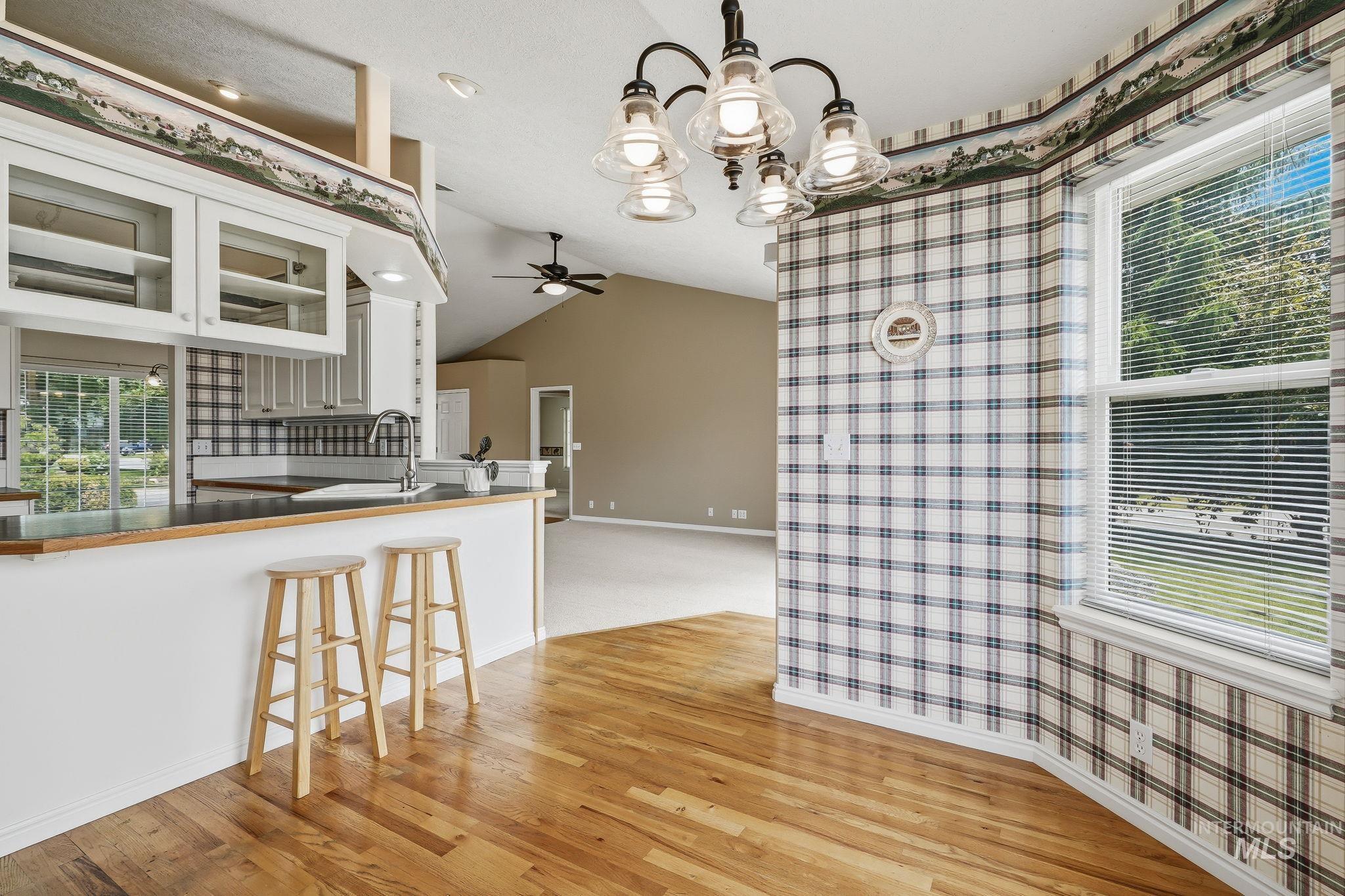 Hardwood flooring throughout dining area