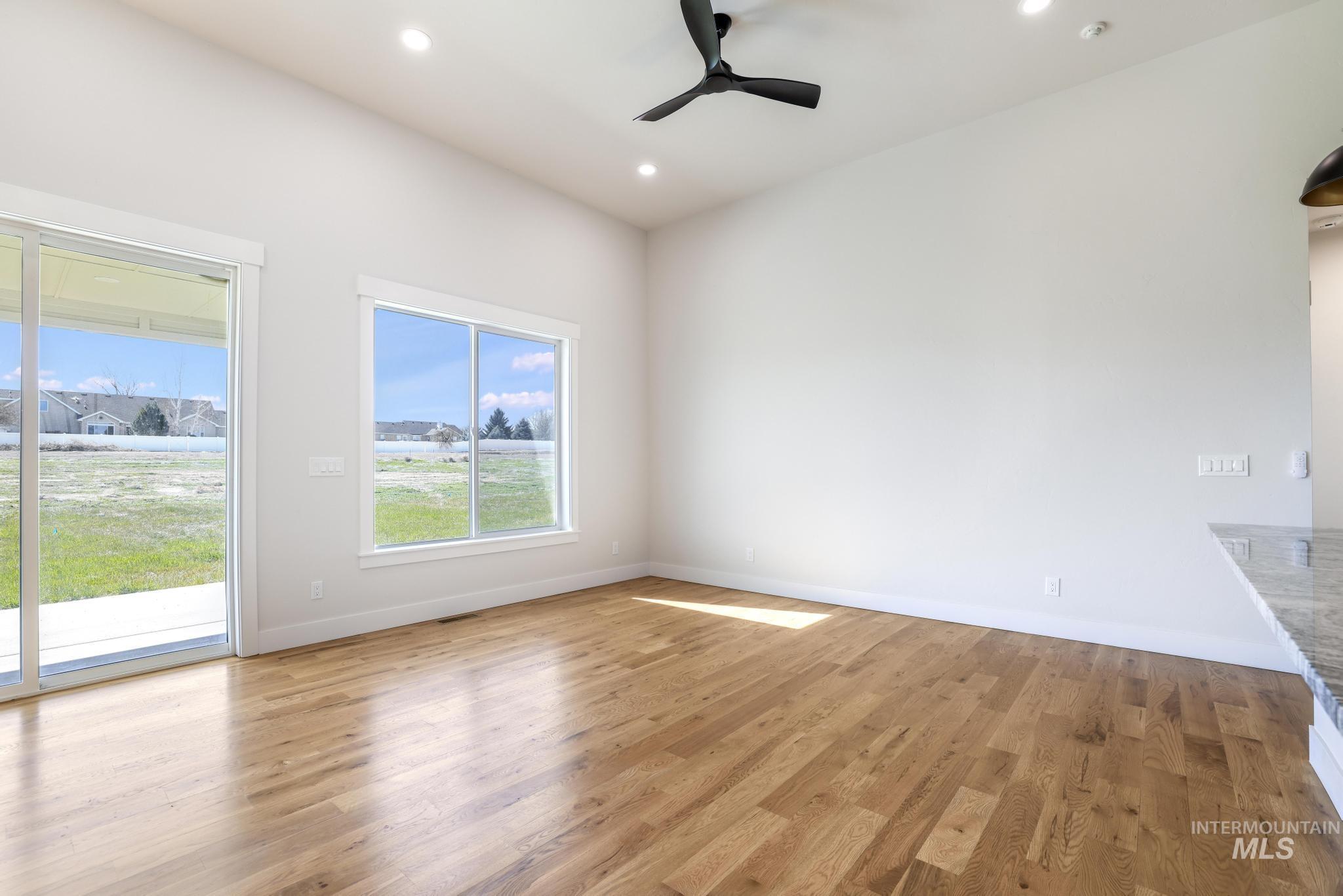Unfurnished dining area with a ceiling fan, light wood finished floors, and recessed lighting