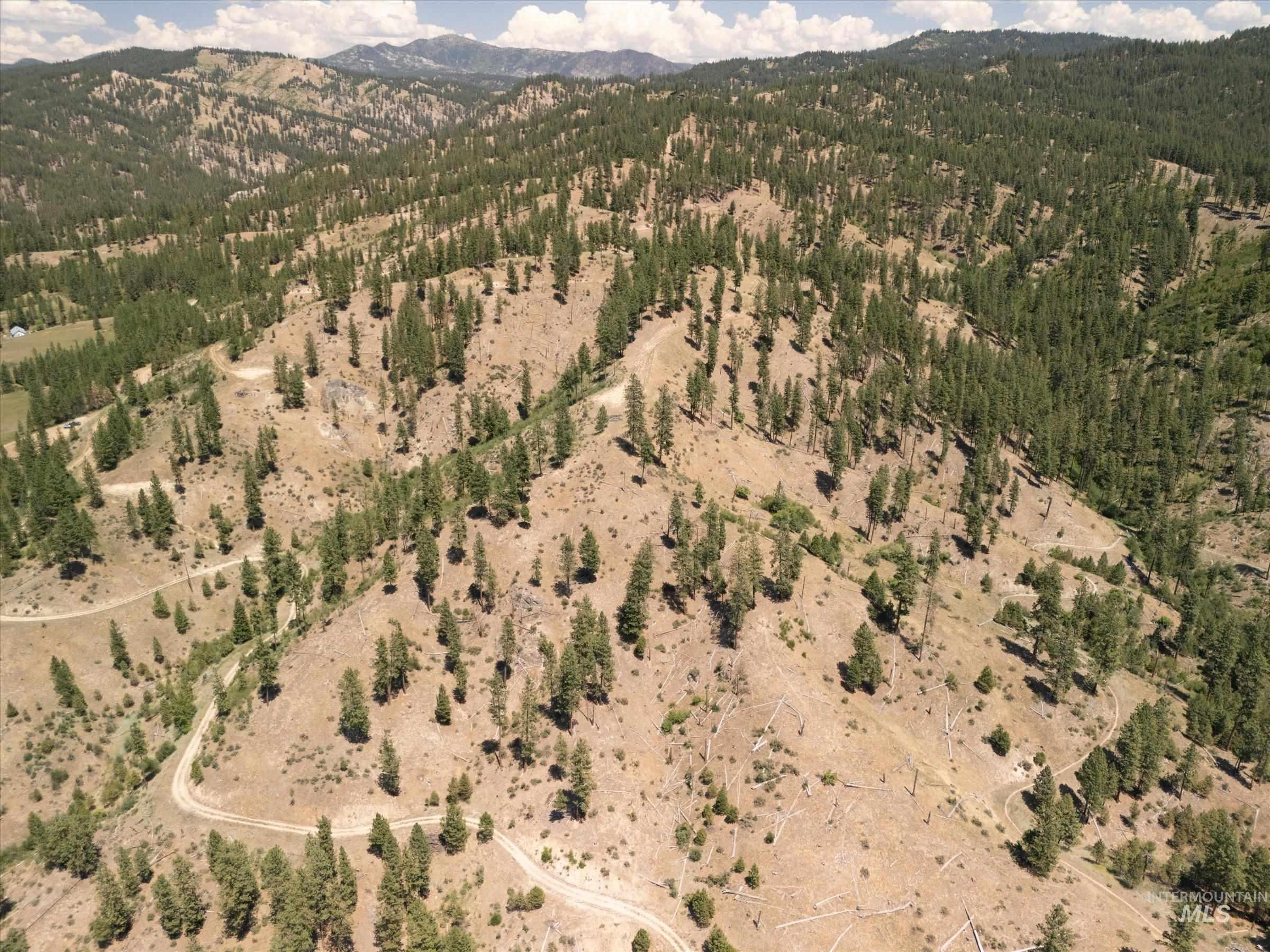 Aerial overview of property's location with a mountain backdrop