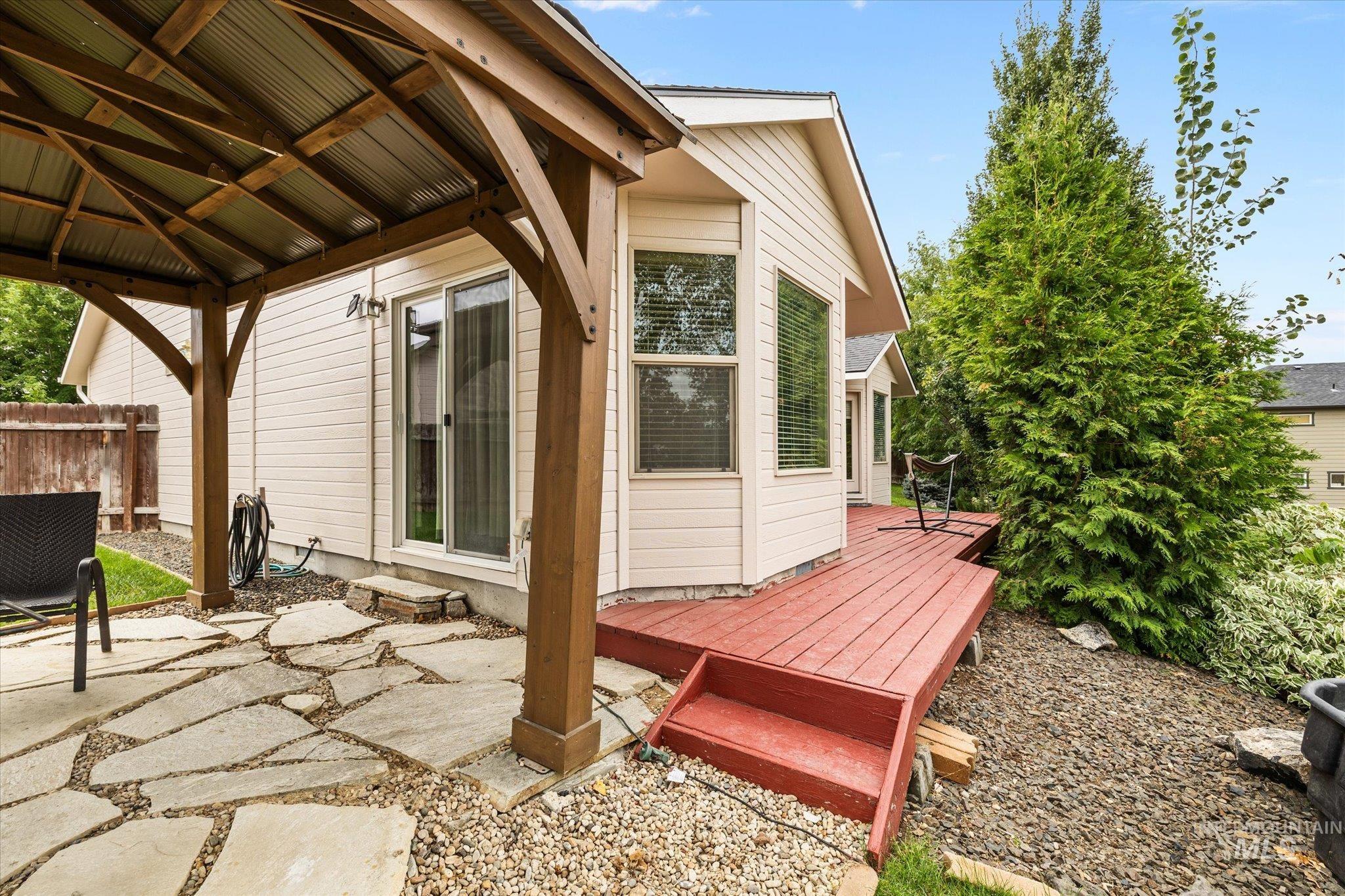 View of patio with a deck and a gazebo