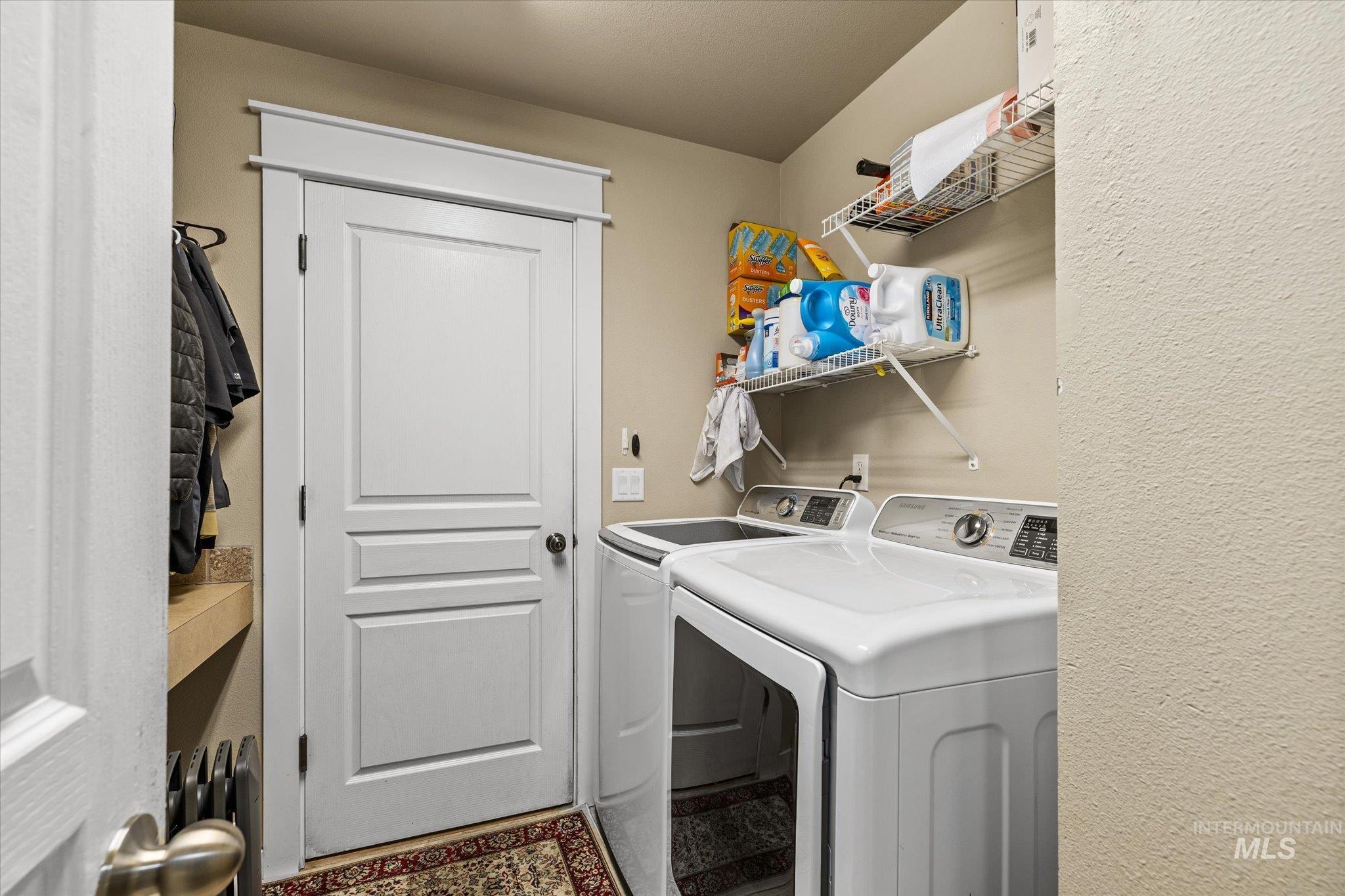 Washroom with washing machine and dryer
