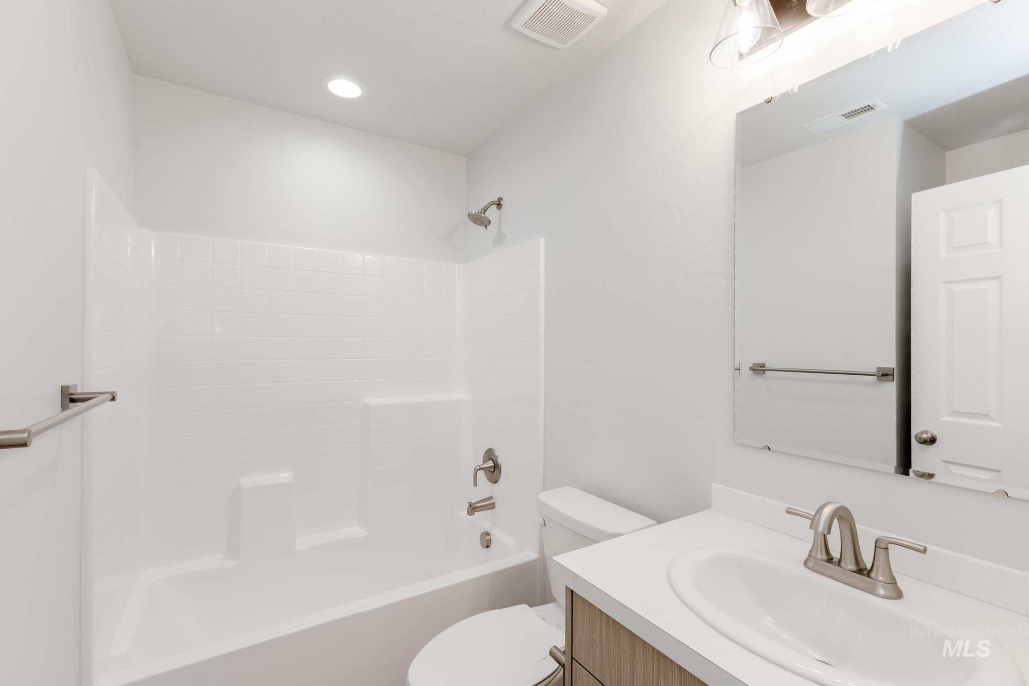 Full bathroom featuring vanity and tub / shower combination