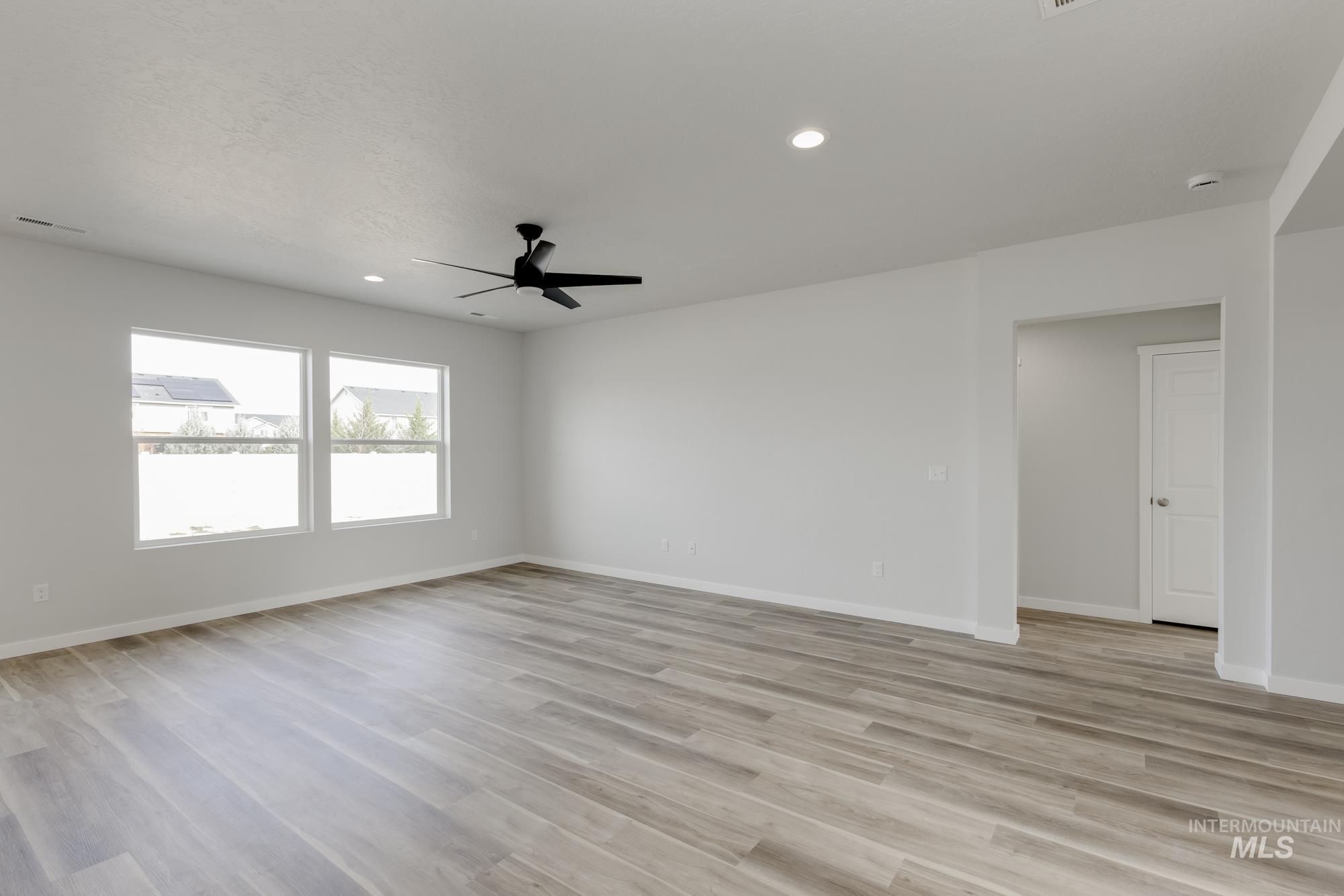 Spare room with recessed lighting, light wood-style floors, and ceiling fan