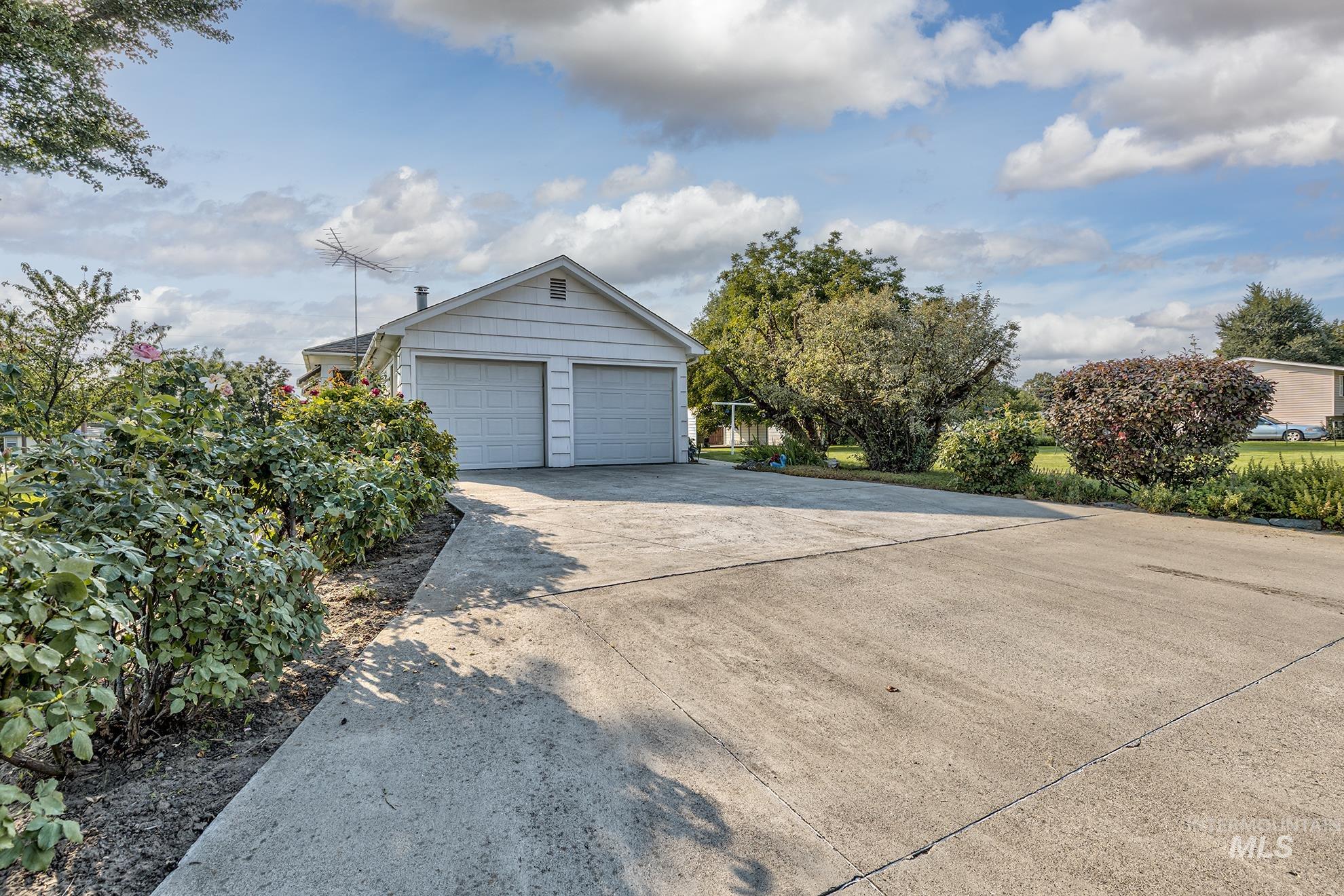 Garage featuring driveway