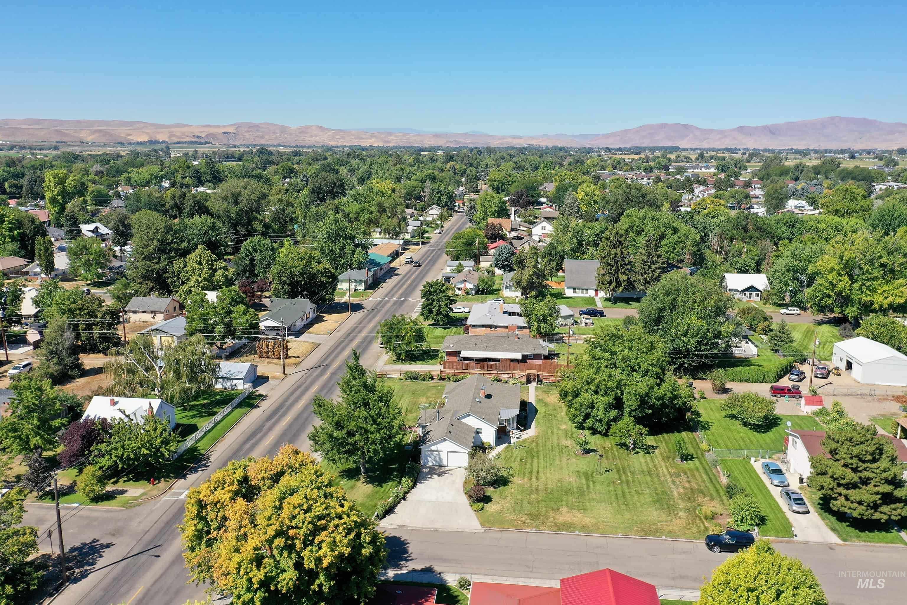 Aerial perspective of suburban area with a mountain backdrop