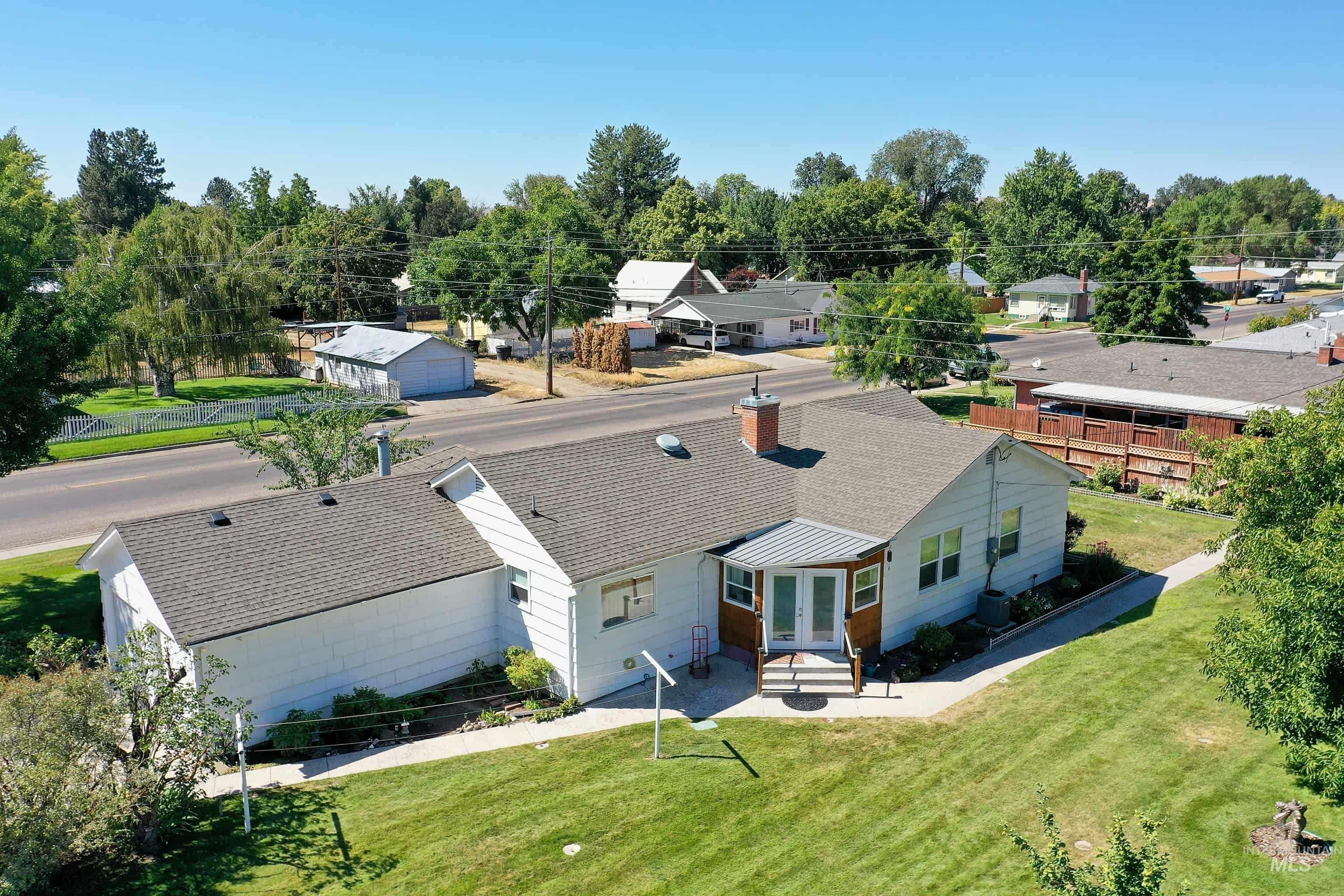 Aerial perspective of suburban area featuring a tree filled landscape