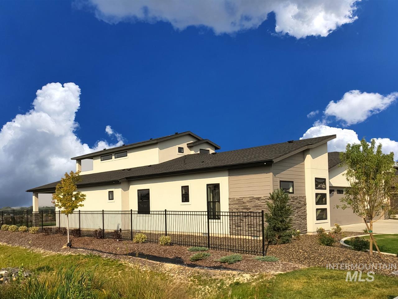 View of side of property with stucco siding and stone siding
