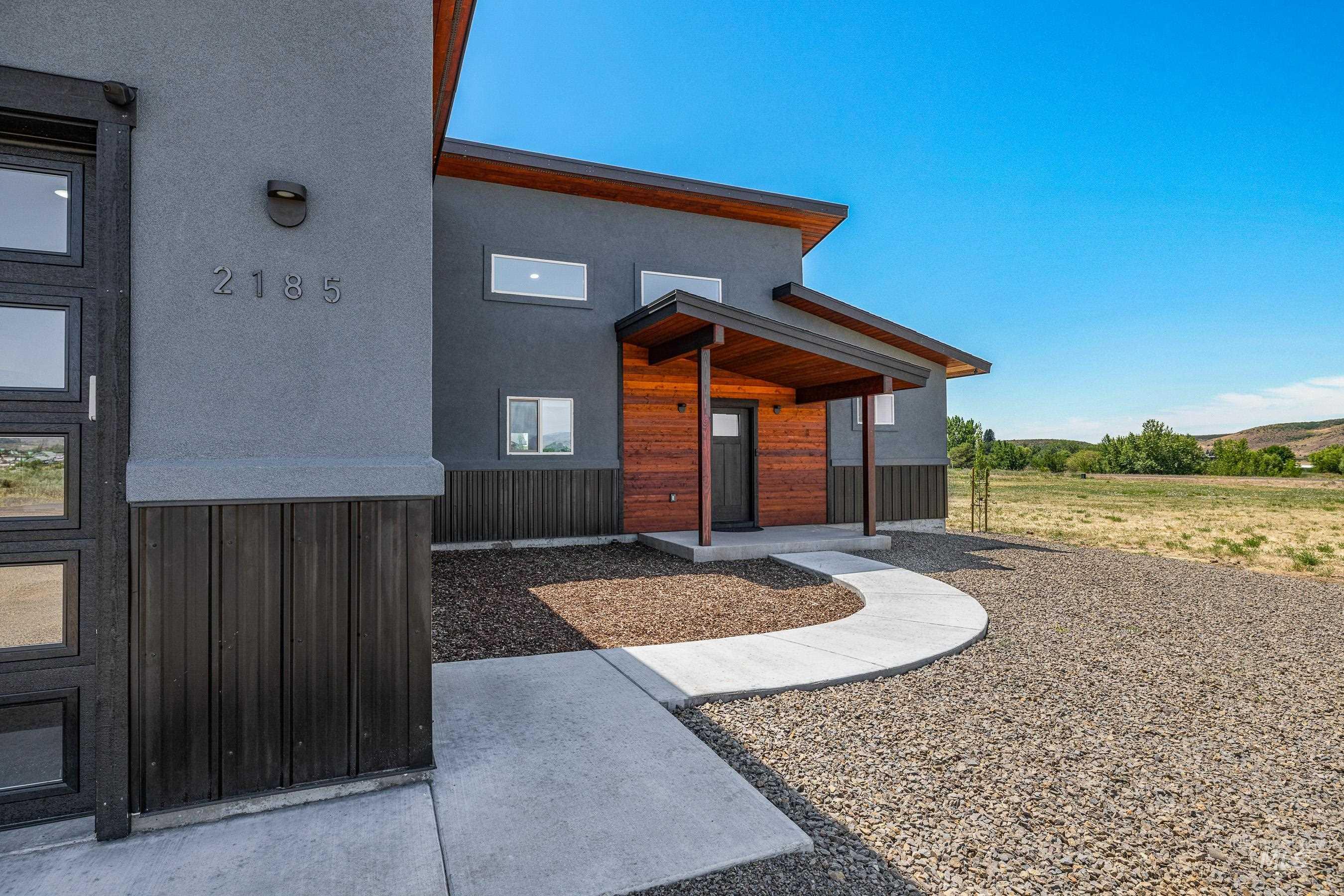 Entrance to property with stucco siding