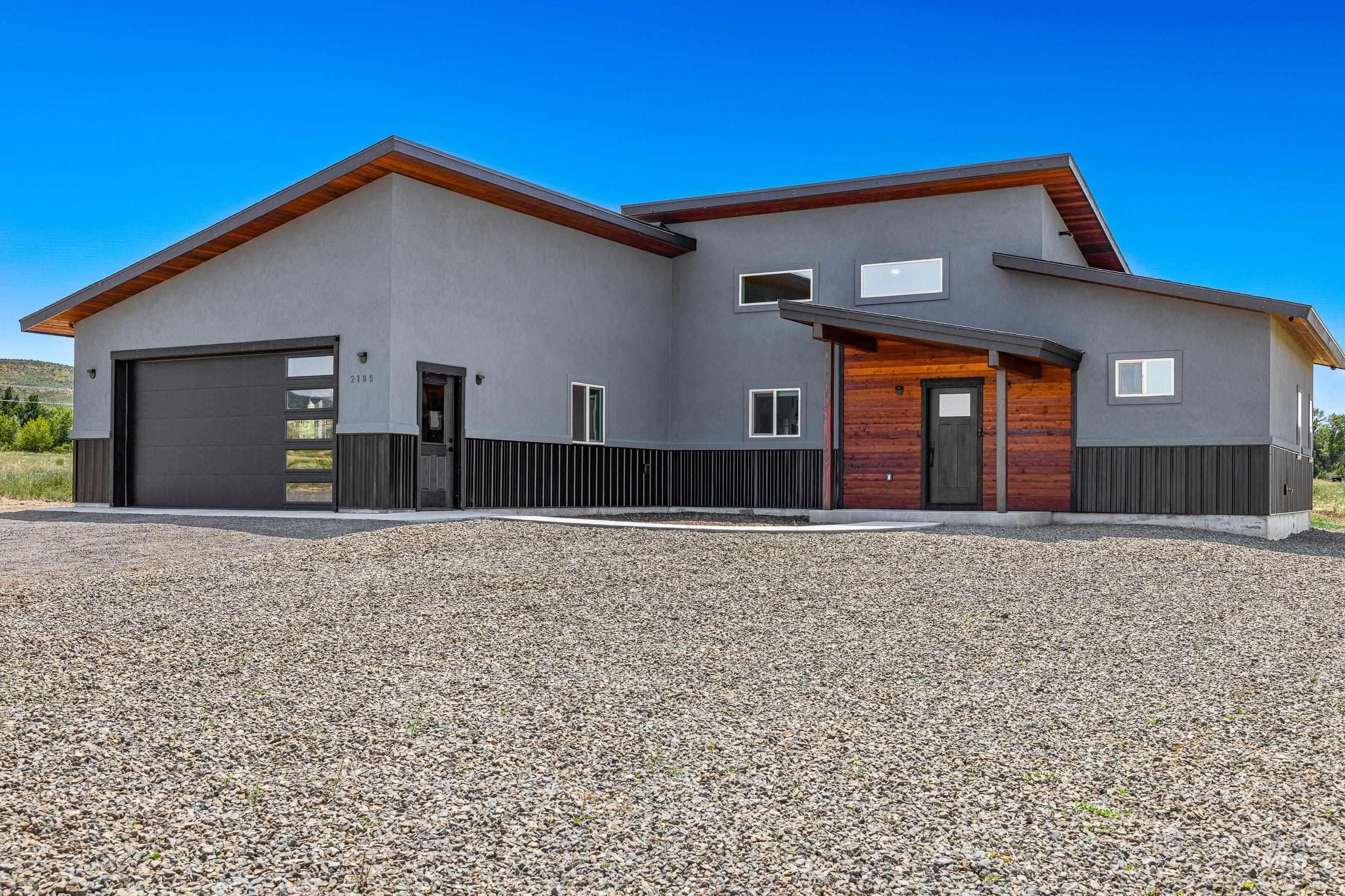 Modern home featuring stucco siding and a garage