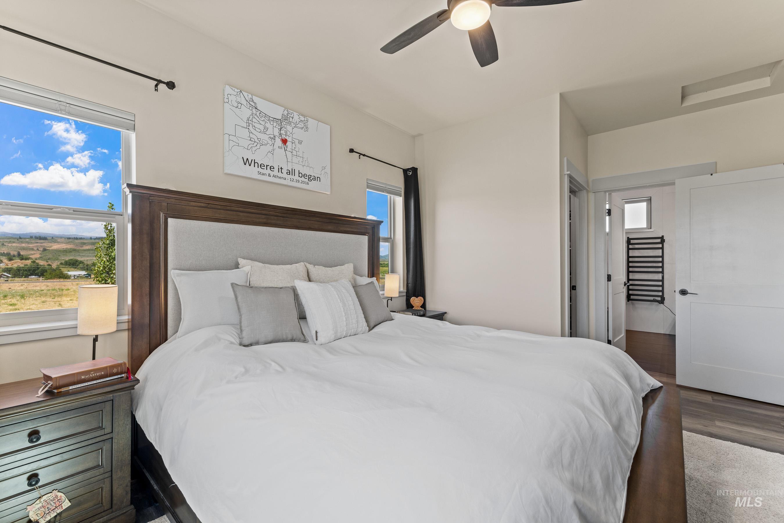Bedroom featuring wood finished floors and ceiling fan