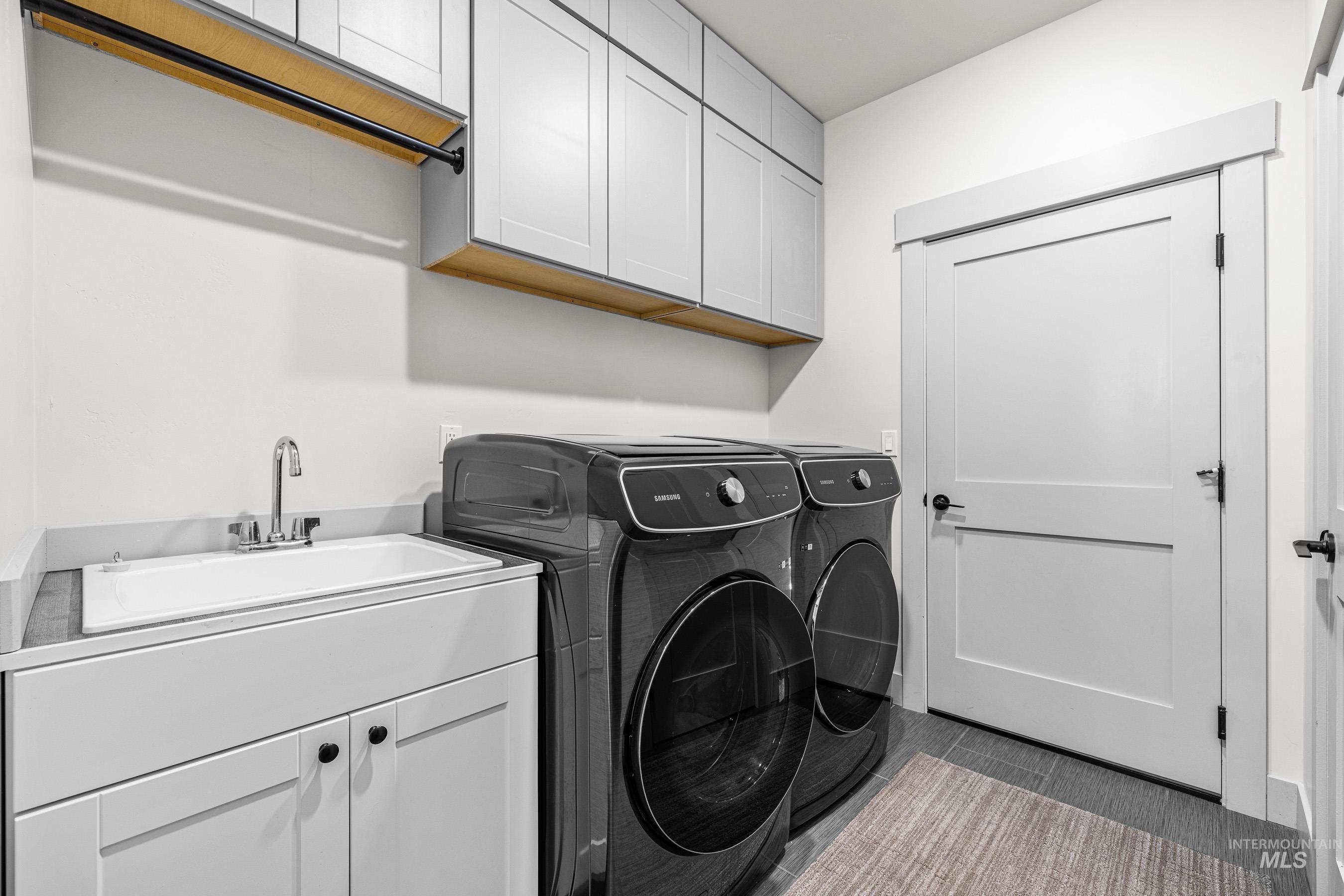 Washroom with independent washer and dryer and cabinet space