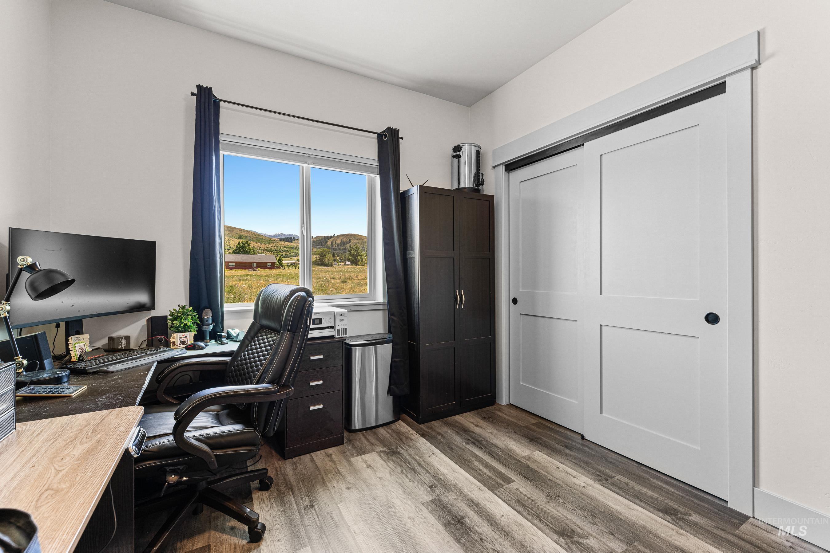 Office area featuring light wood-style flooring