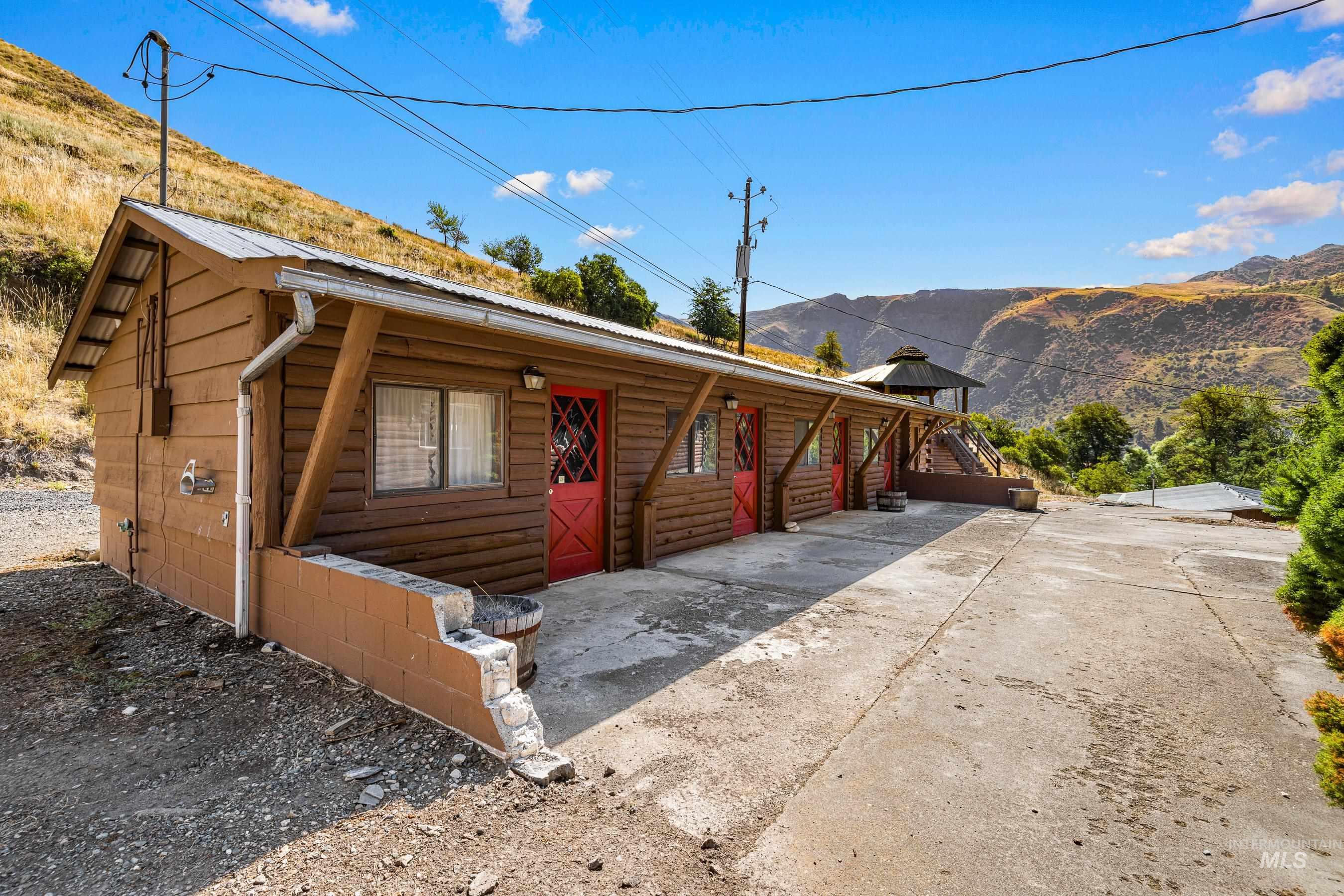 Office building - w/ 4 units w/ bathroom & laundry space. Building currently not plumbed.