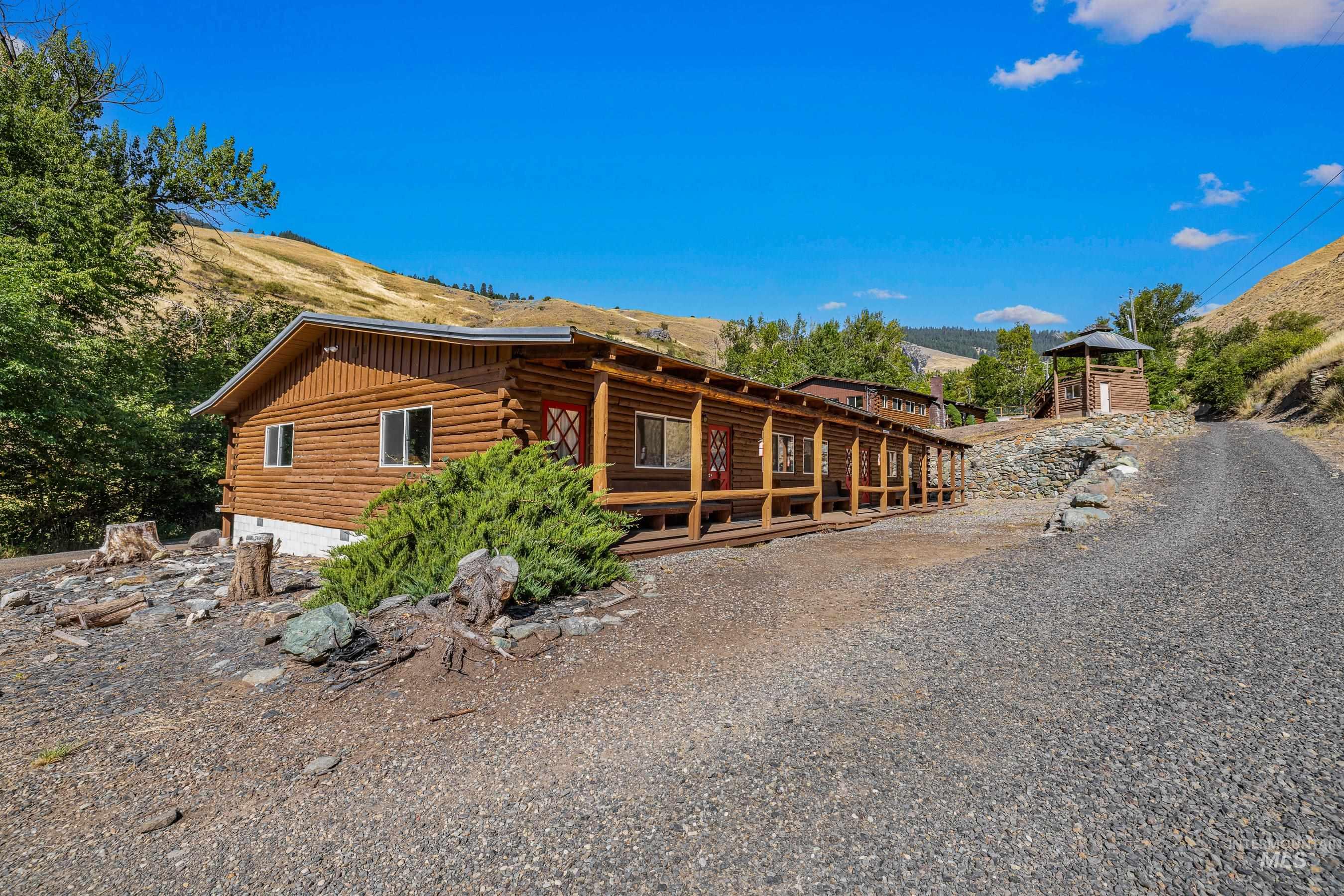 View of side of property with log siding and a mountain view