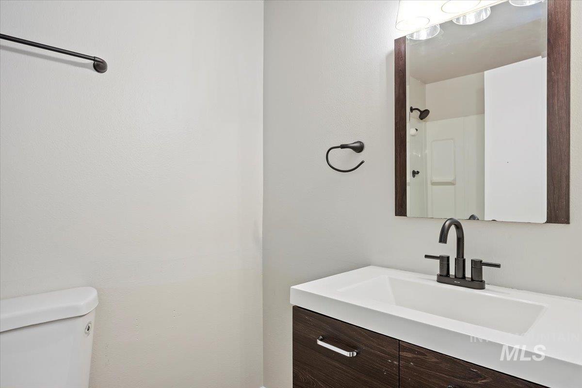 Bathroom with vanity and toilet